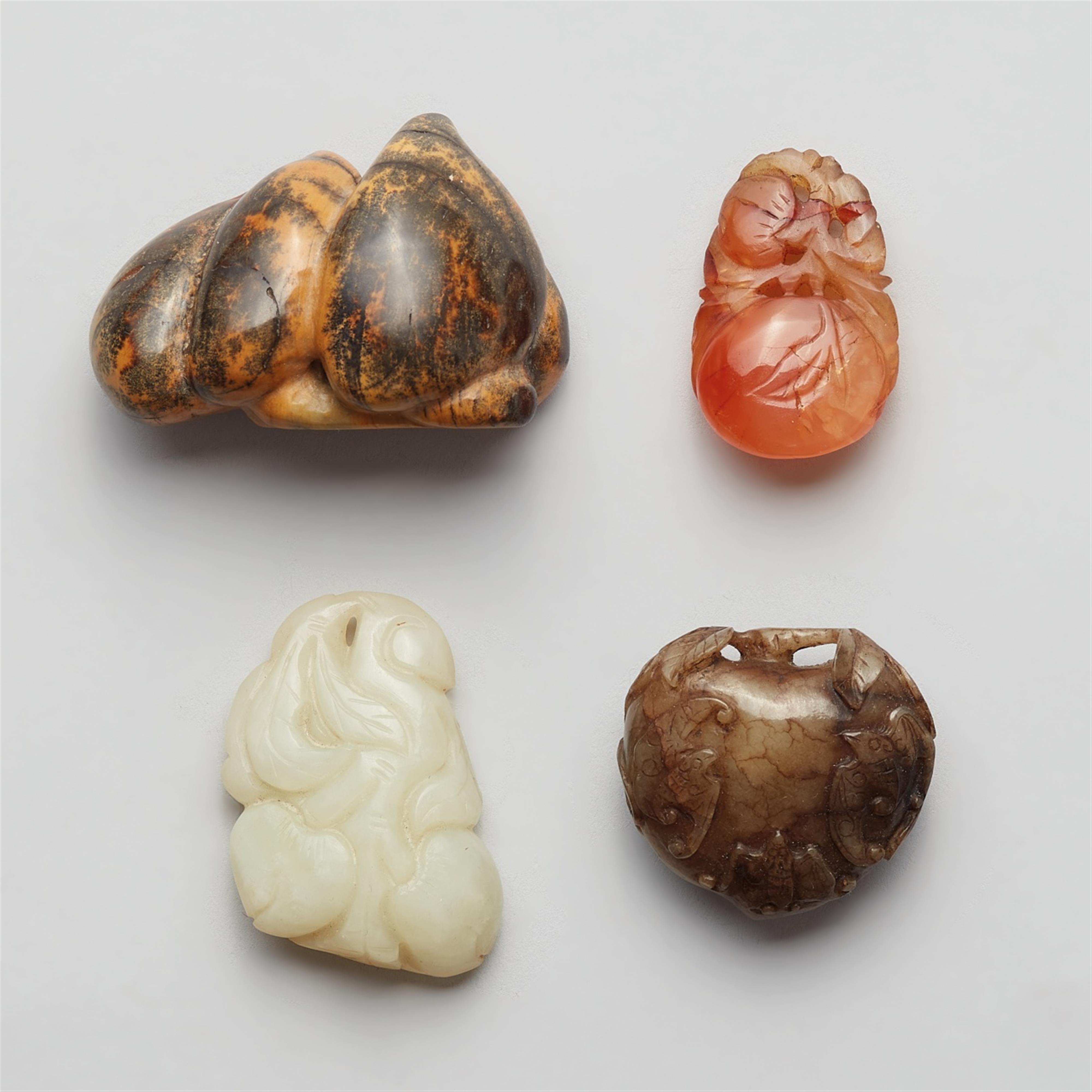 A set of four jade and stone toggle in the shape of peaches - image-1