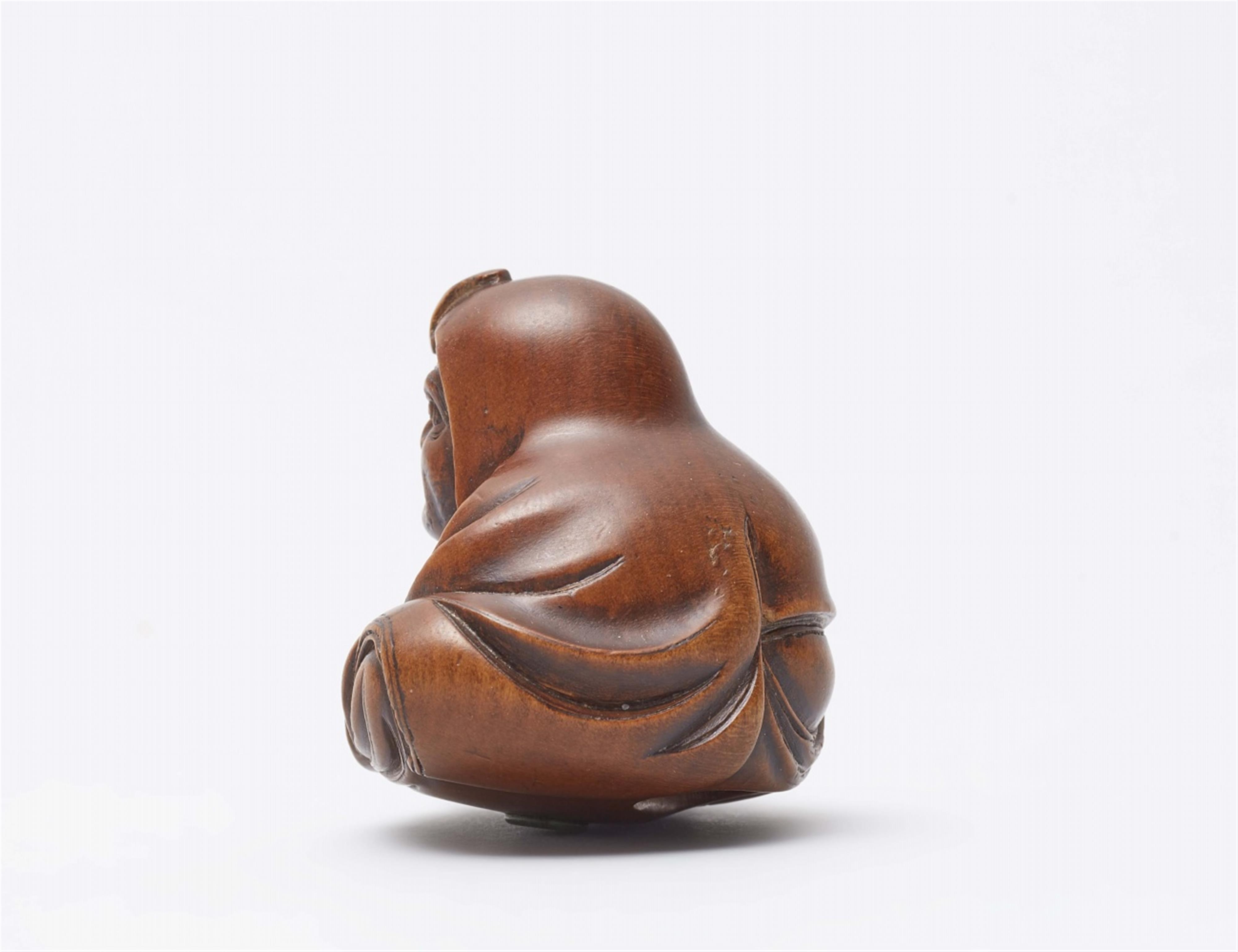 Daruma playing kamifuki. Boxwood. Mid-19th century - image-2