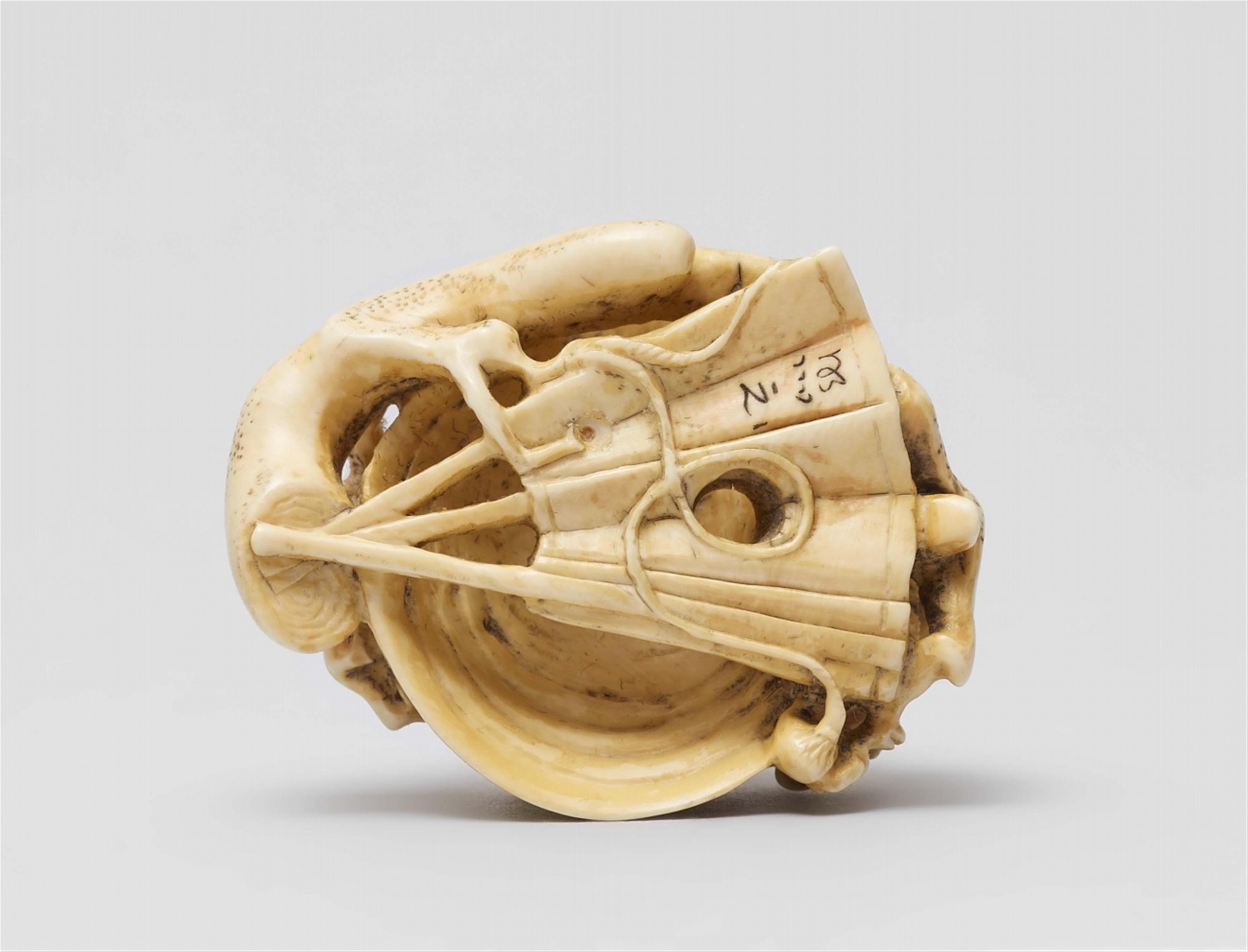 An ivory netsuke of a kabuto on plum branches. Second half 19th century - image-5