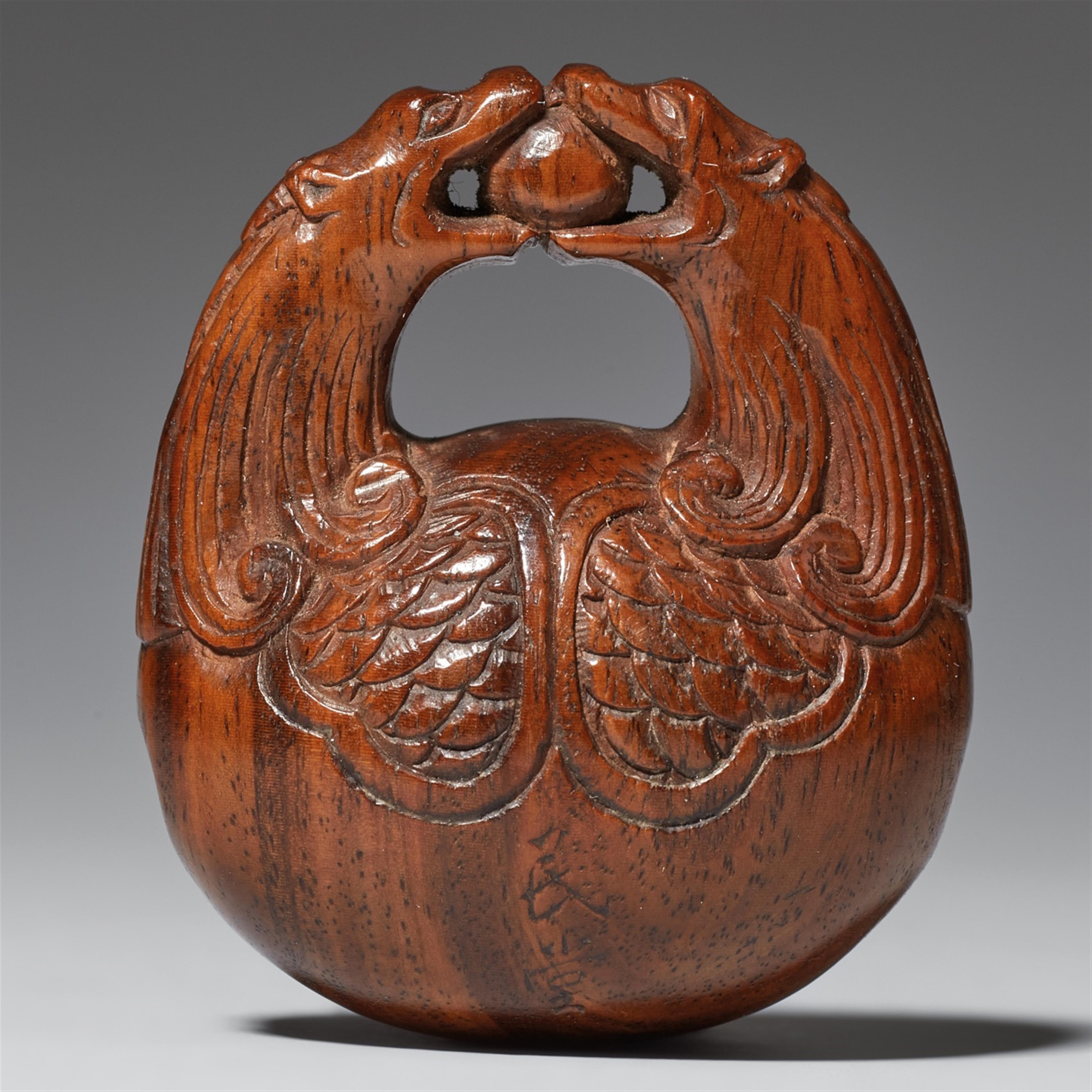 A wood netsuke of a mokugyo. Late 19th century - image-1