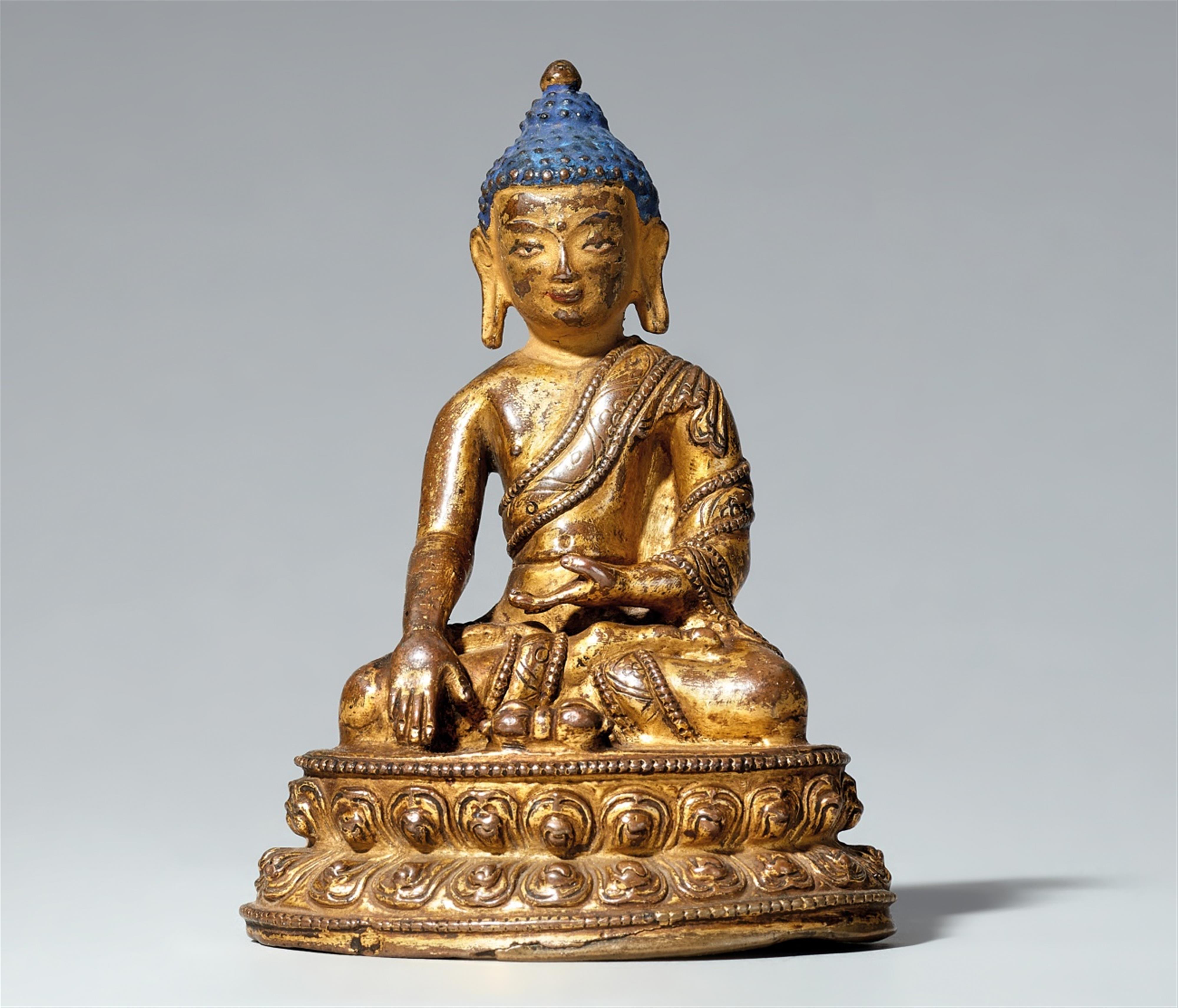 A Tibetan gilt bronze figure of Buddha Shakyamuni with vajra. 15th/16th century - image-1