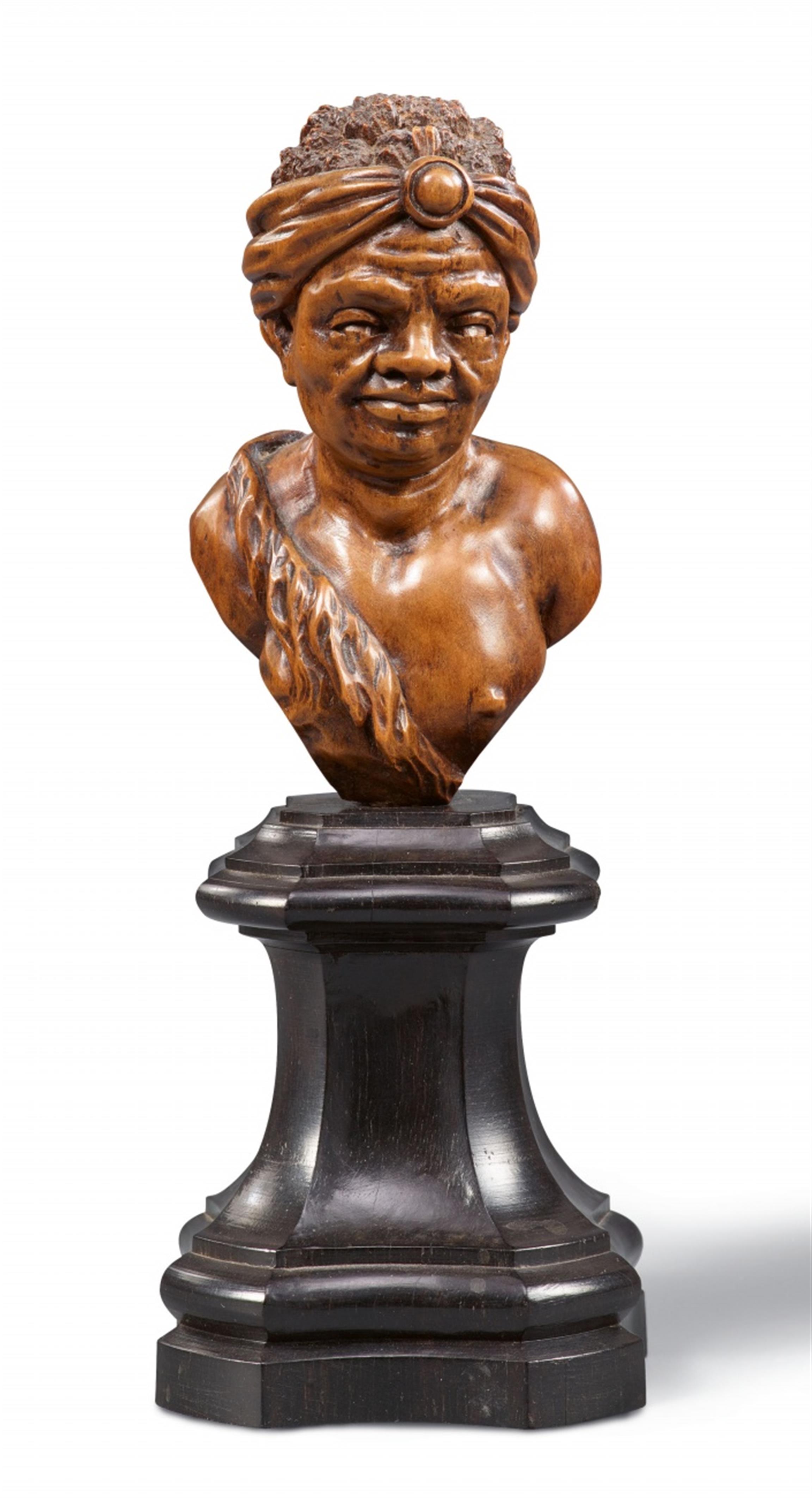 A carved boxwood bust of an African man - image-1