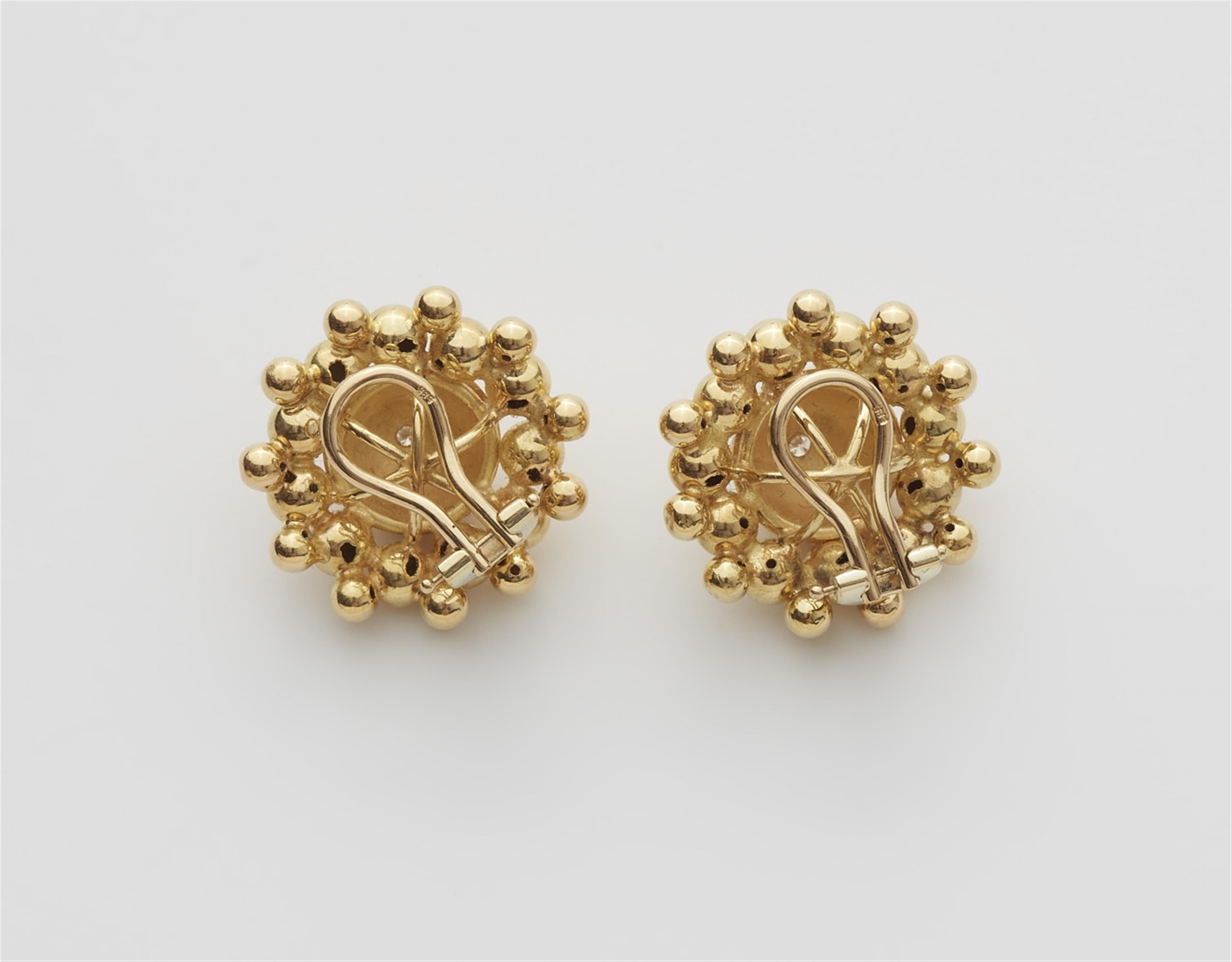 A pair of 14/18k gold clip earrings - image-2