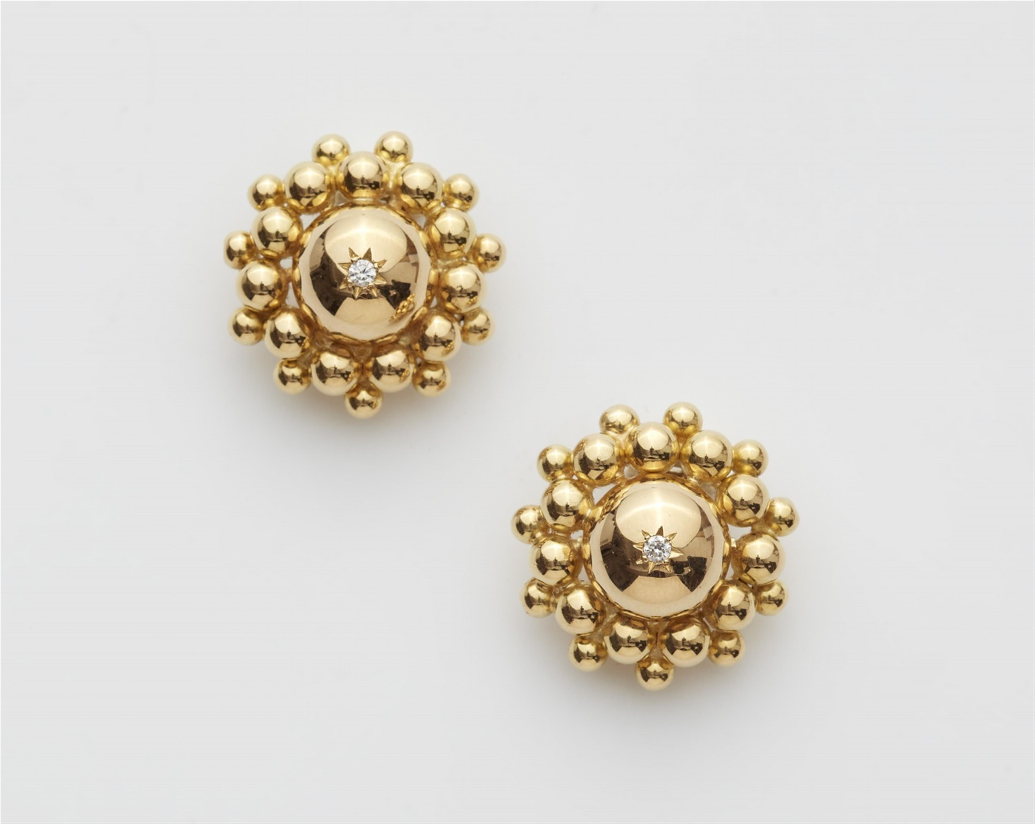 A pair of 14/18k gold clip earrings - image-1