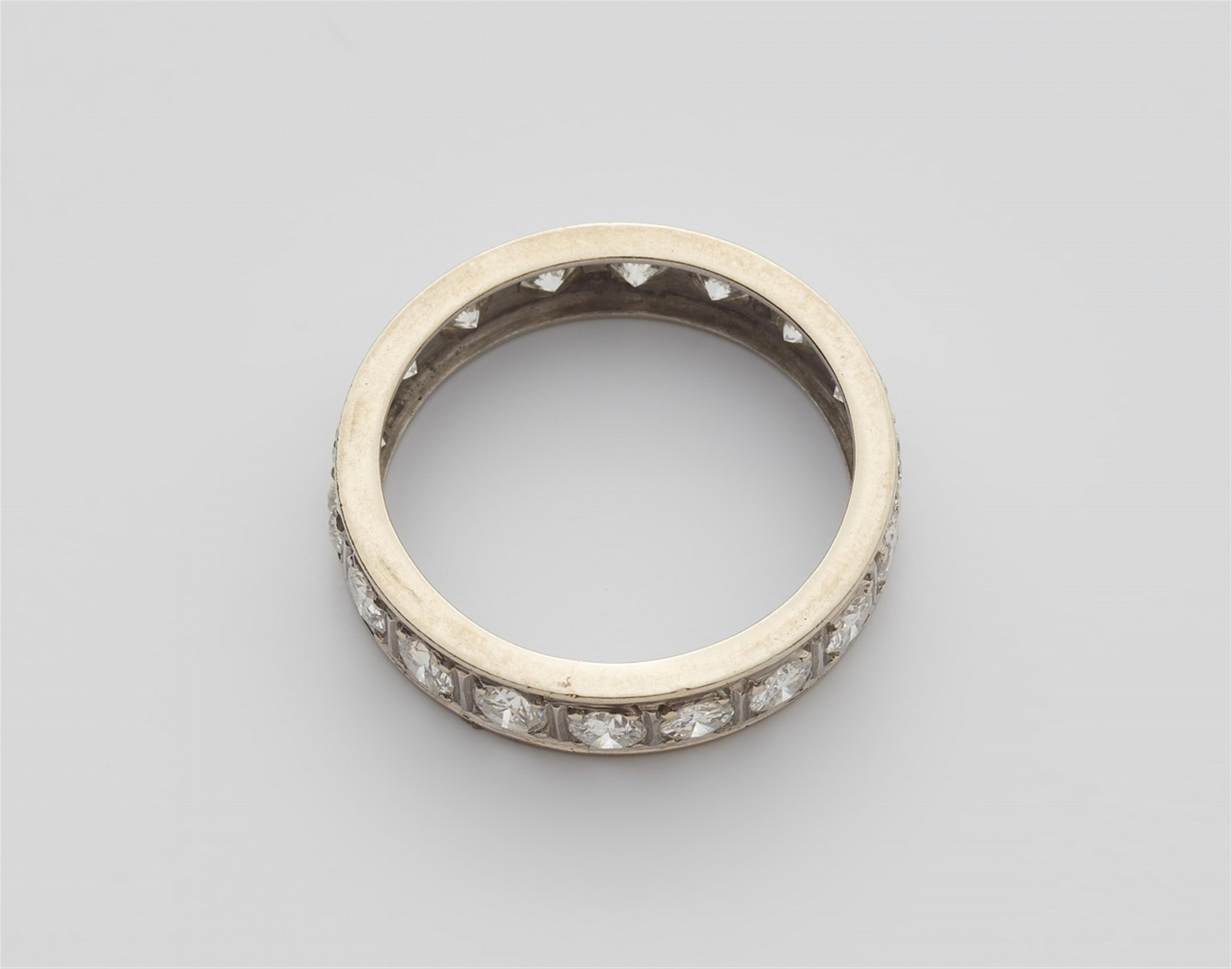 A 14k white gold diamond eternity ring - image-2