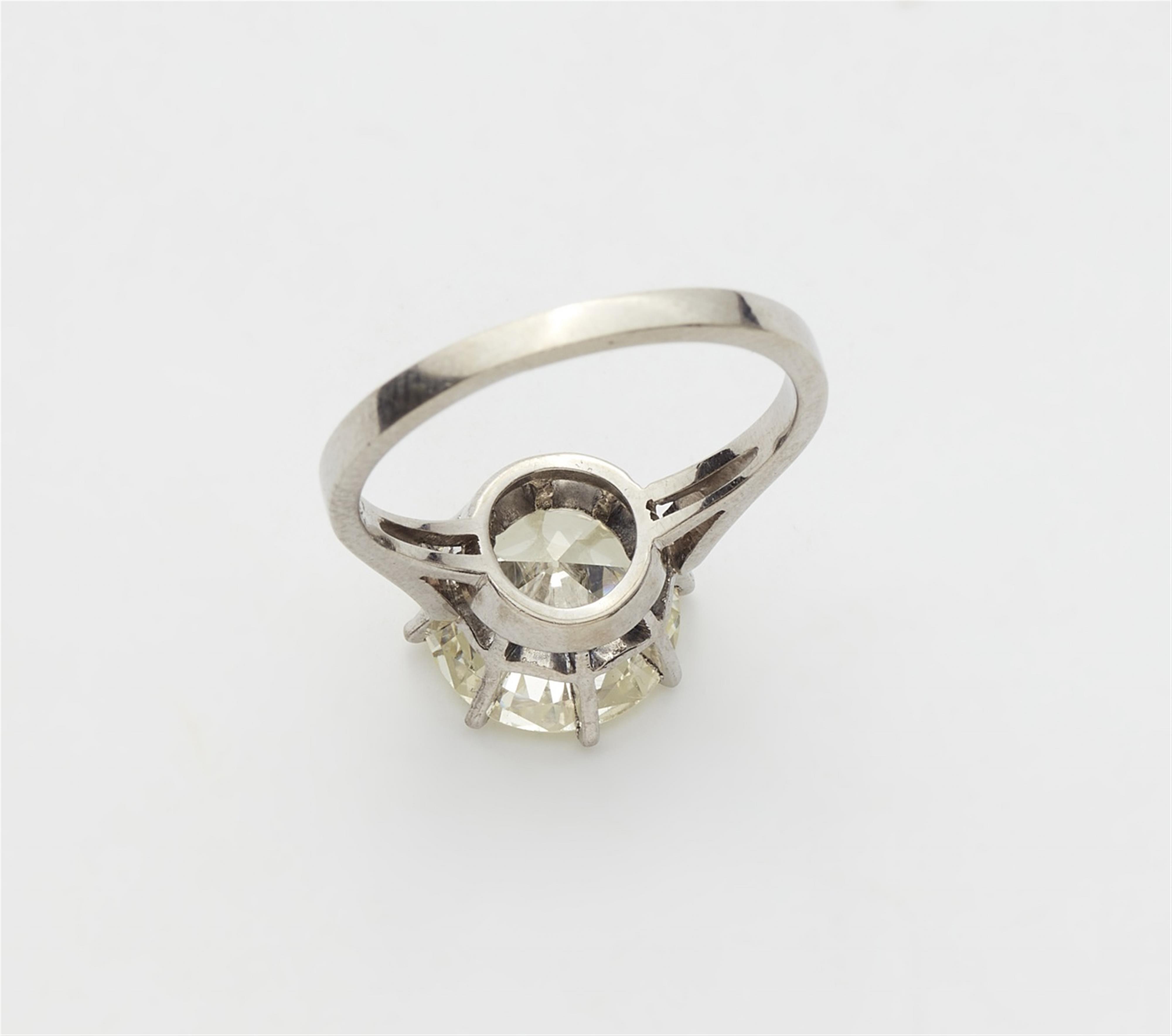 An 18k white gold brilliant-cut diamond solitaire ring - image-2