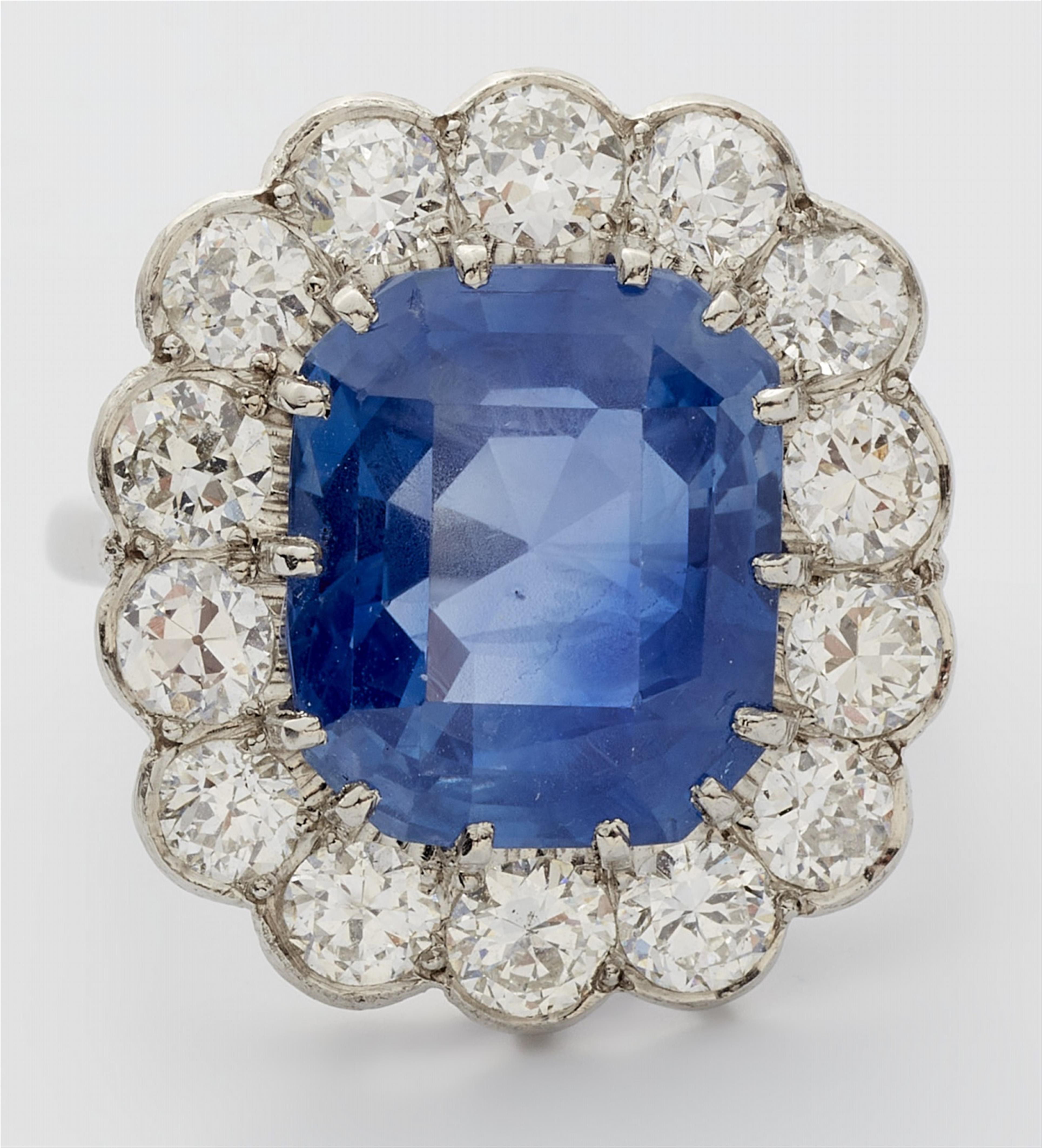 A platinum diamond and natural Ceylon sapphire cluster ring - image-2
