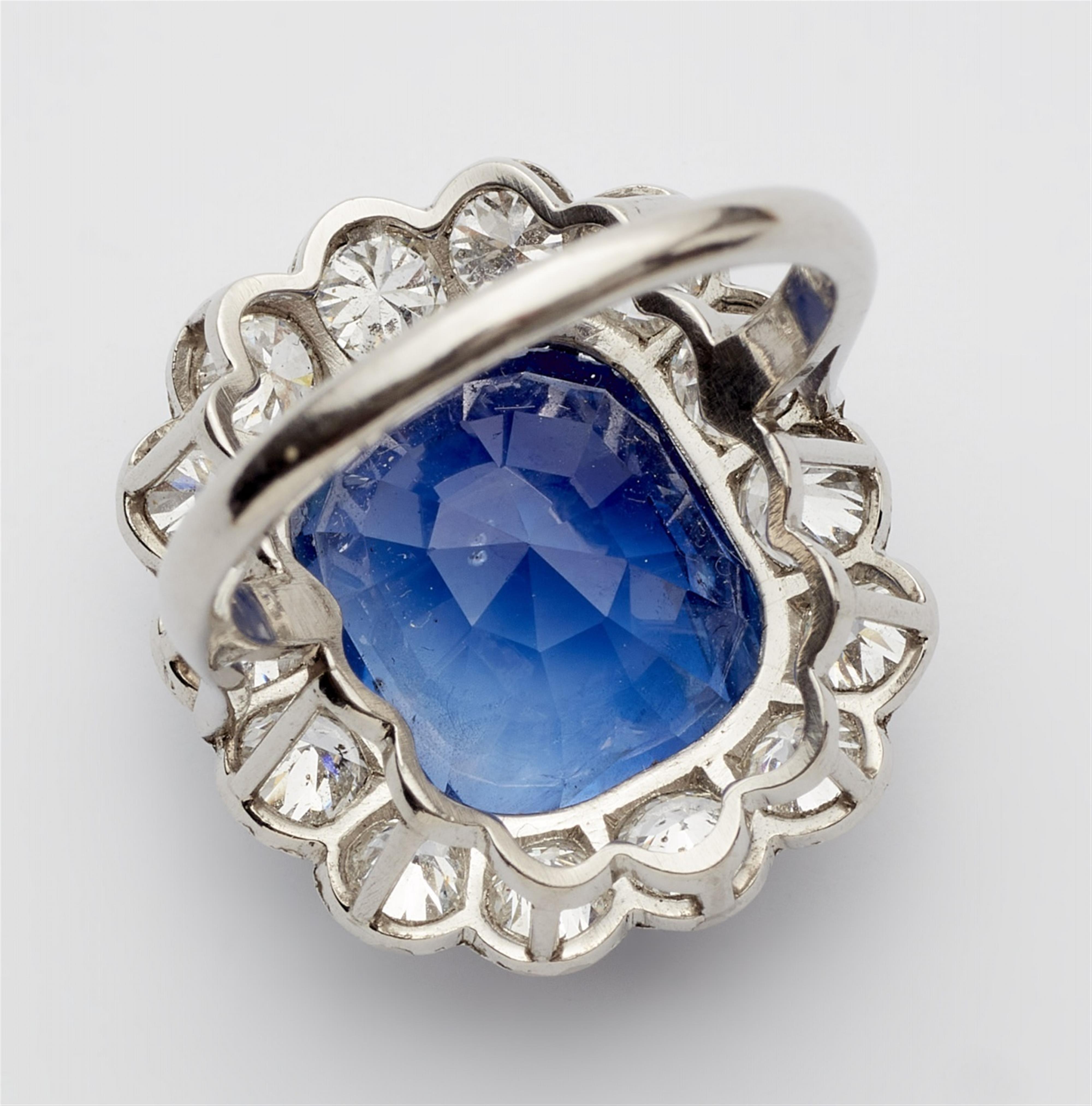 A platinum diamond and natural Ceylon sapphire cluster ring - image-4