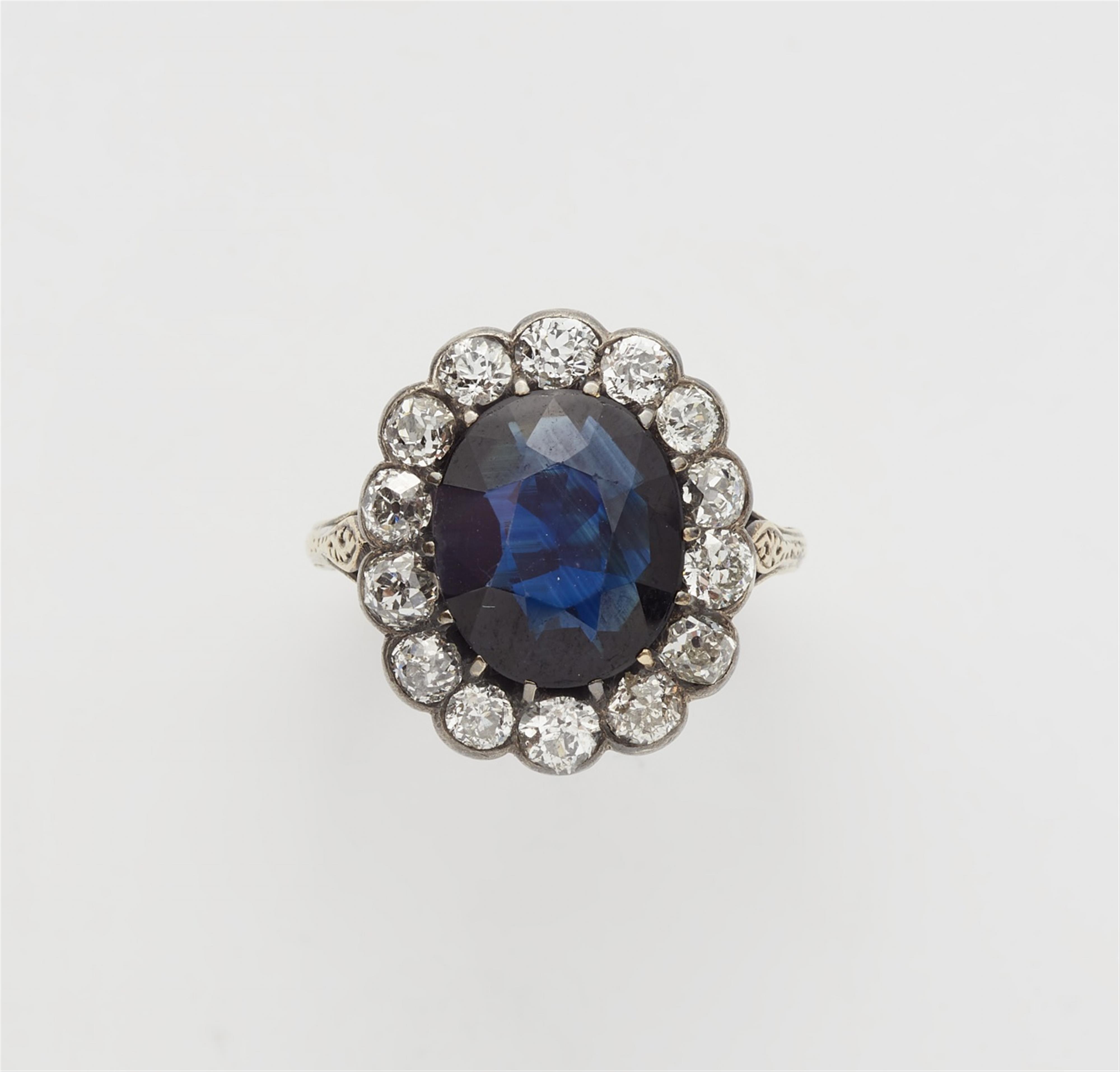 A 14k gold and silver sapphire cluster ring - image-1