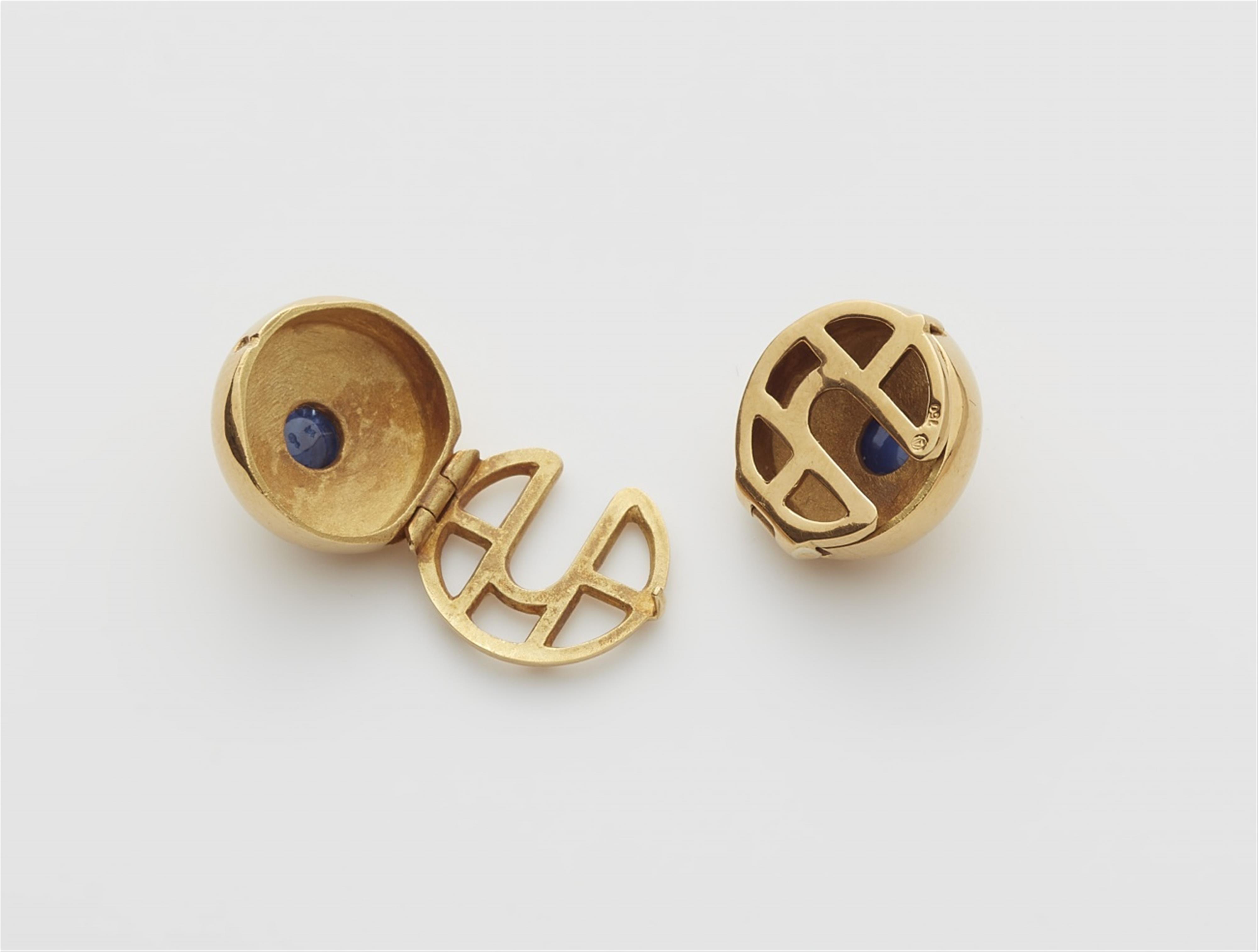A pair of 18k gold and sapphire button covers - image-2
