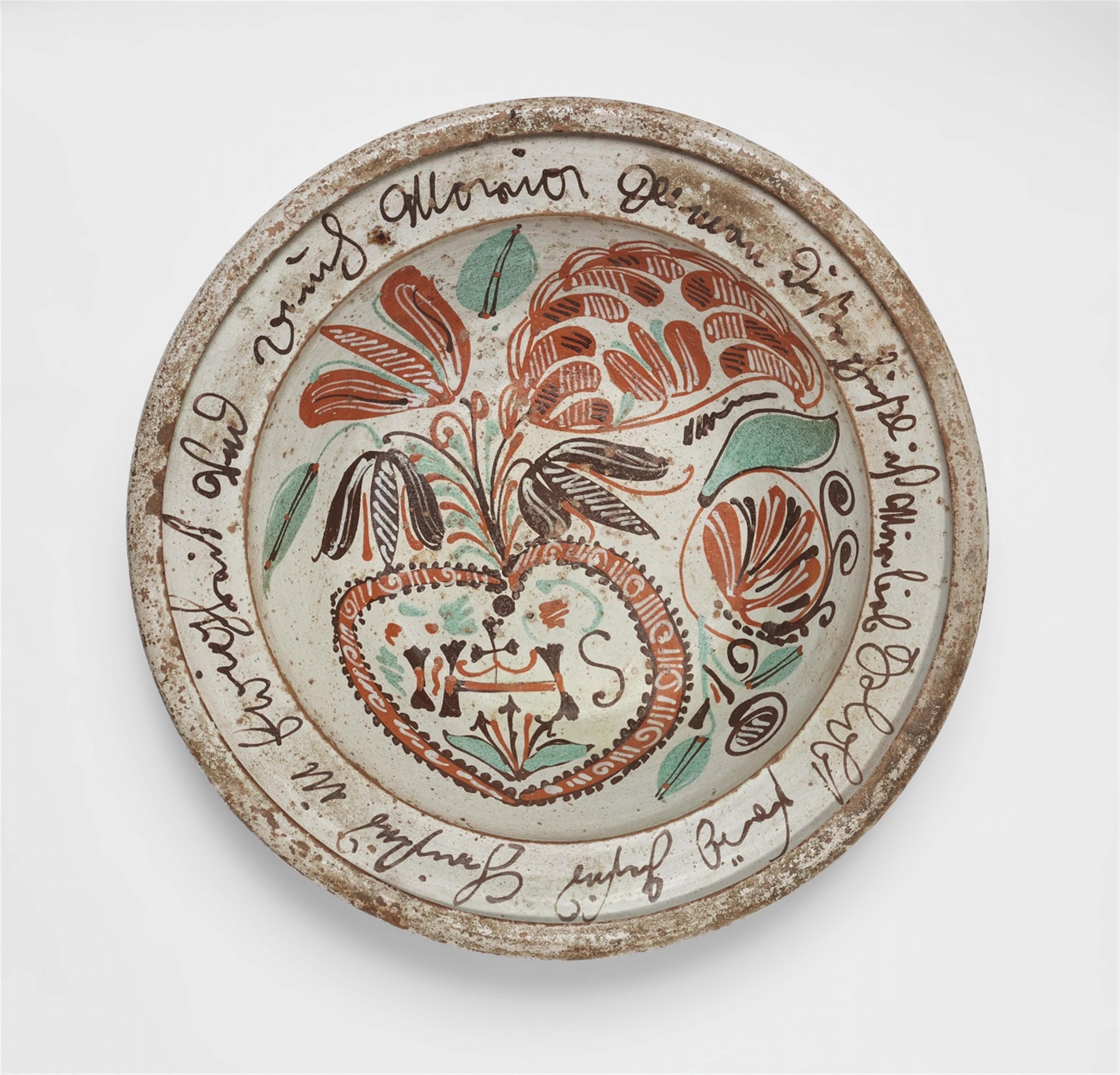 An earthenware dish with a banderole - image-1