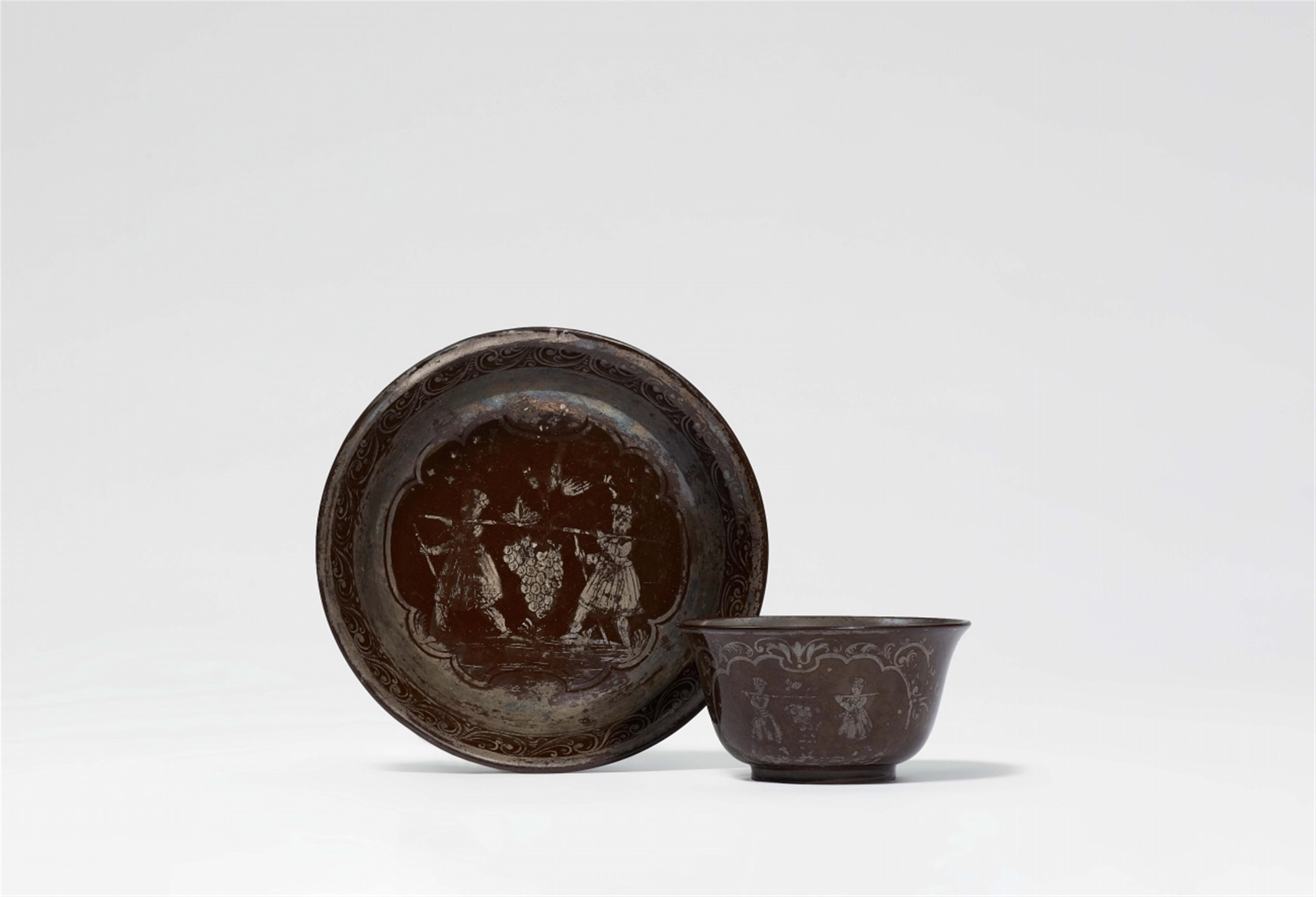 A Bayreuth red earthenware teabowl and saucer with a “Kalebstraube“ - image-1