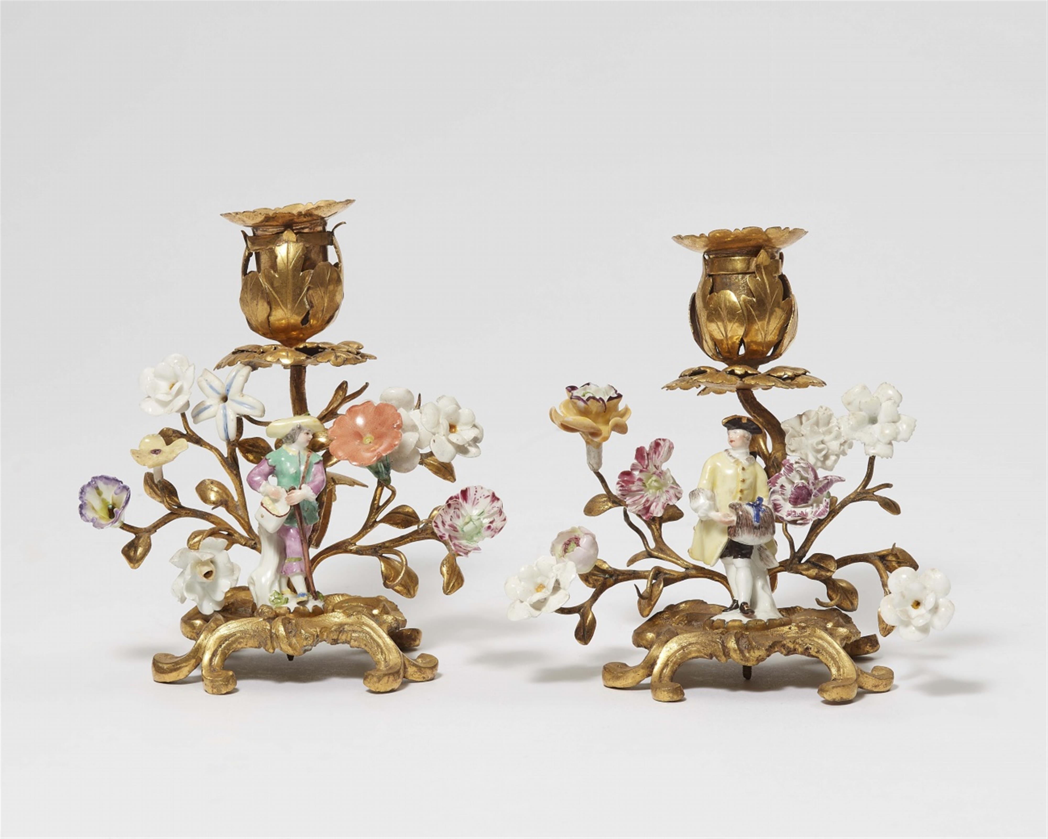 A pair of small candlesticks with porcelain figures - image-1