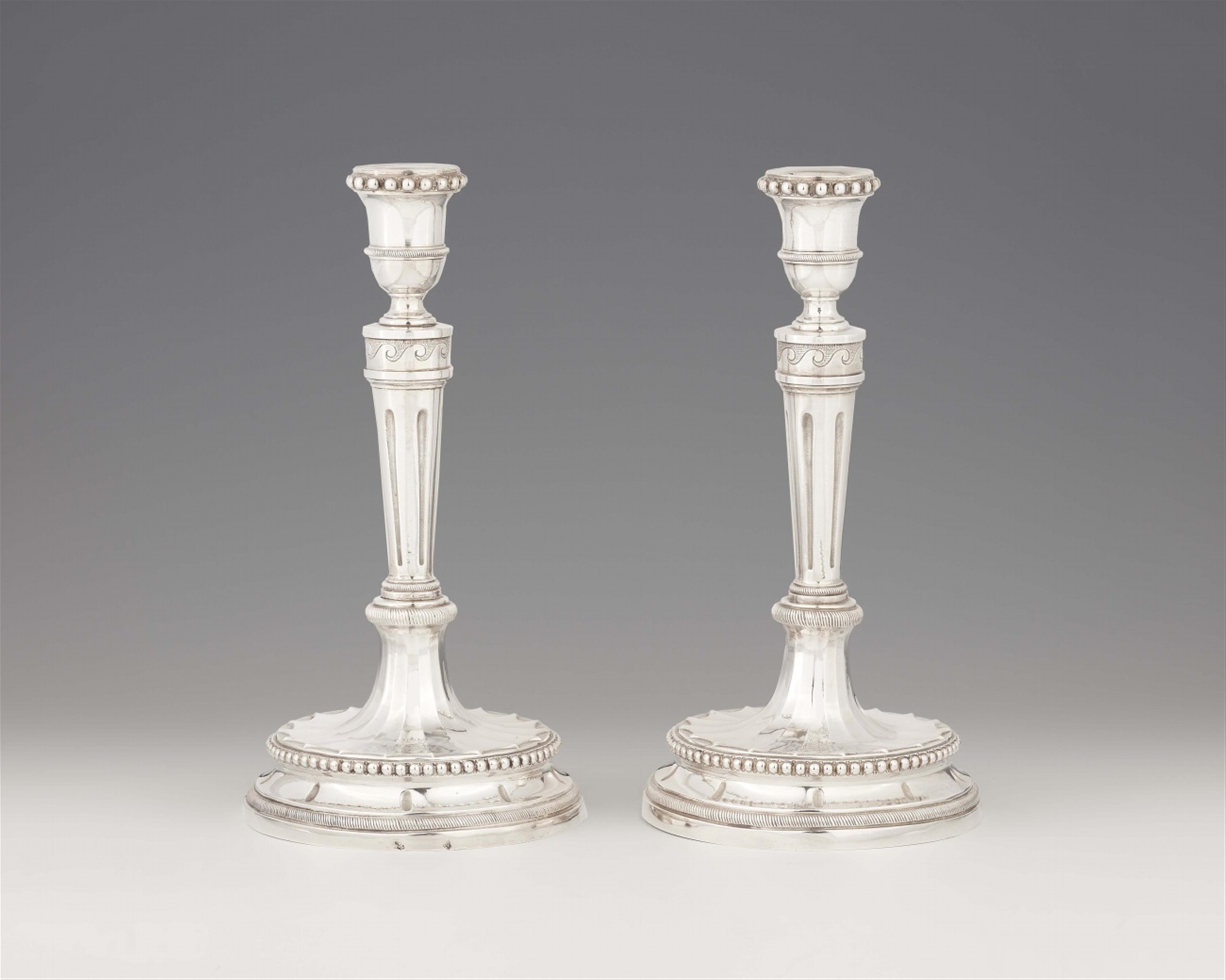 A pair of Roman silver candlesticks - image-1