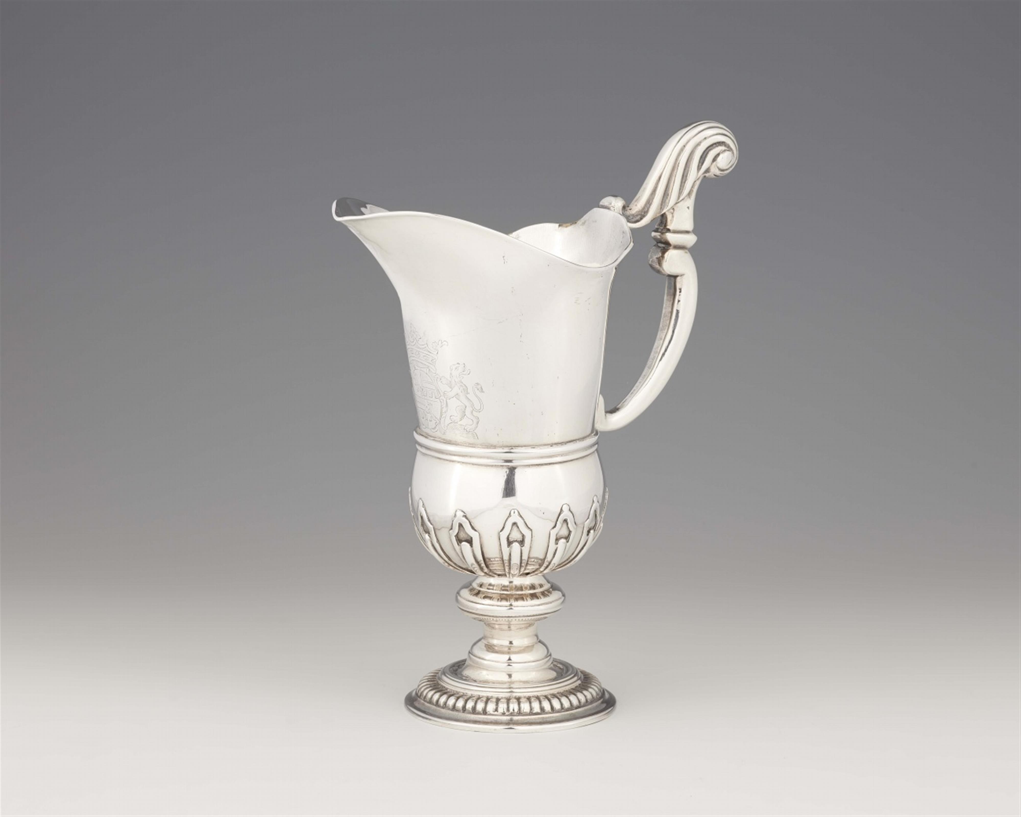 A silver pitcher - image-1