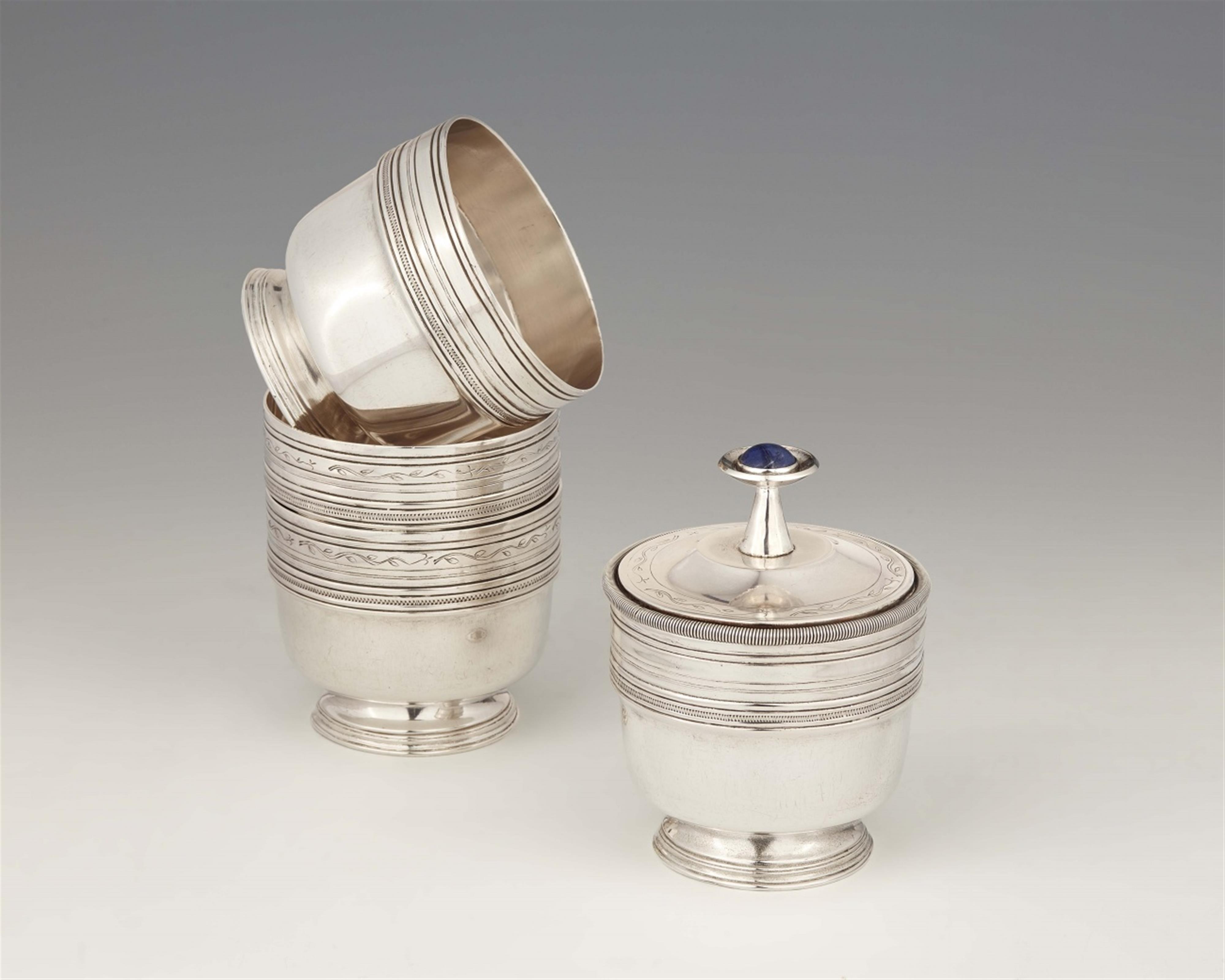 A nest of four silver beakers - image-1