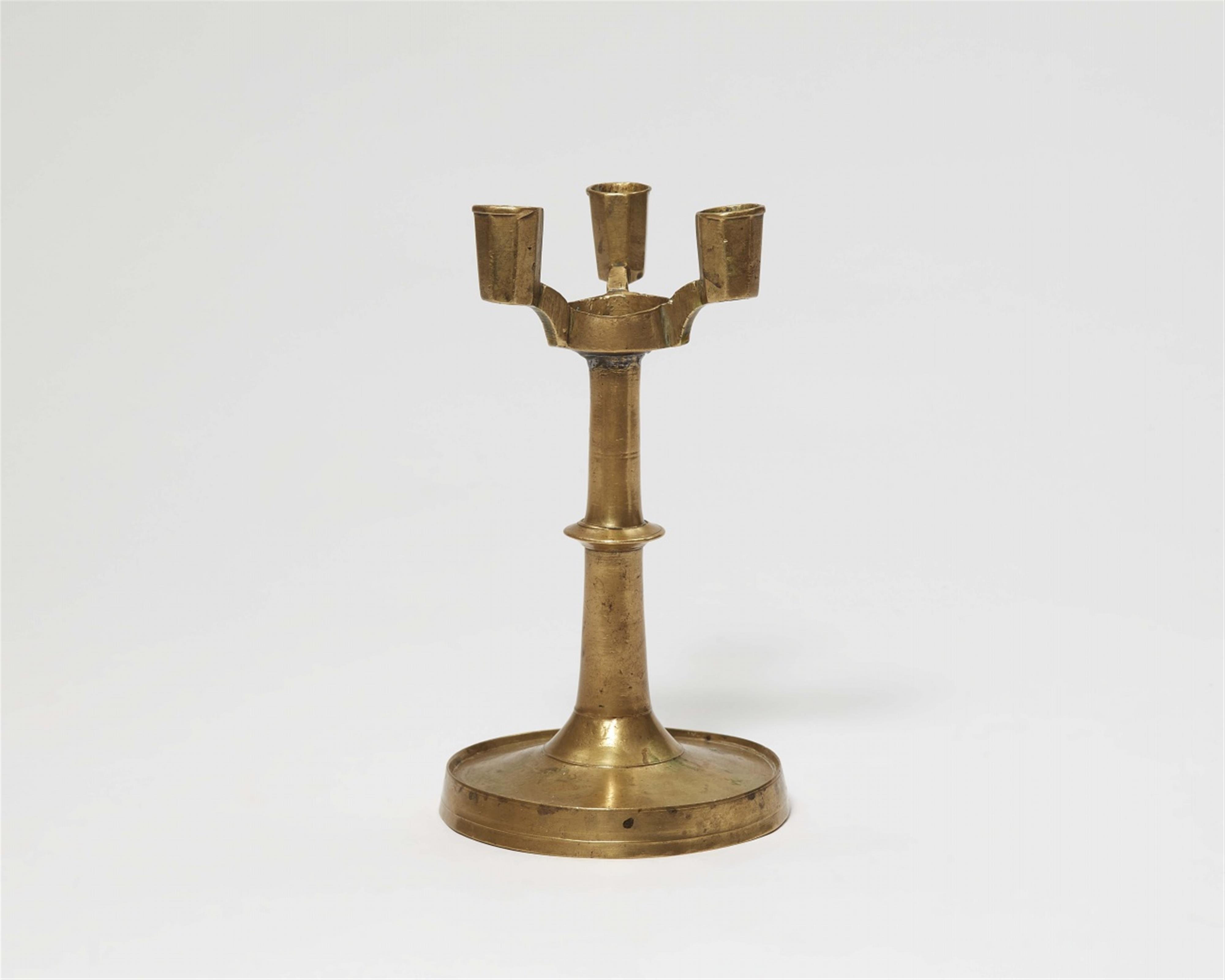 A Gothic brass candlestick - image-1