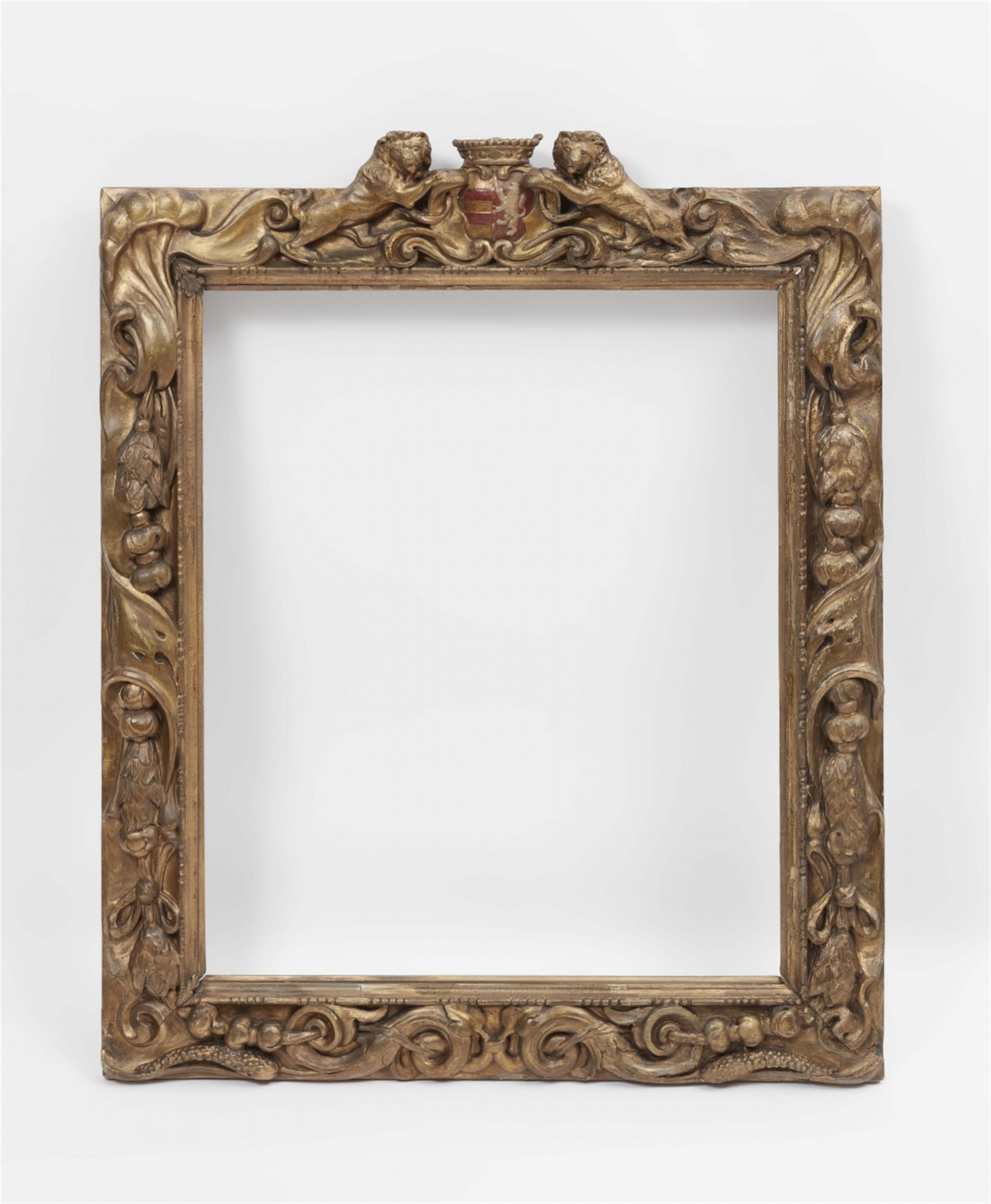 A carved Flemish frame with coat of arms - image-1