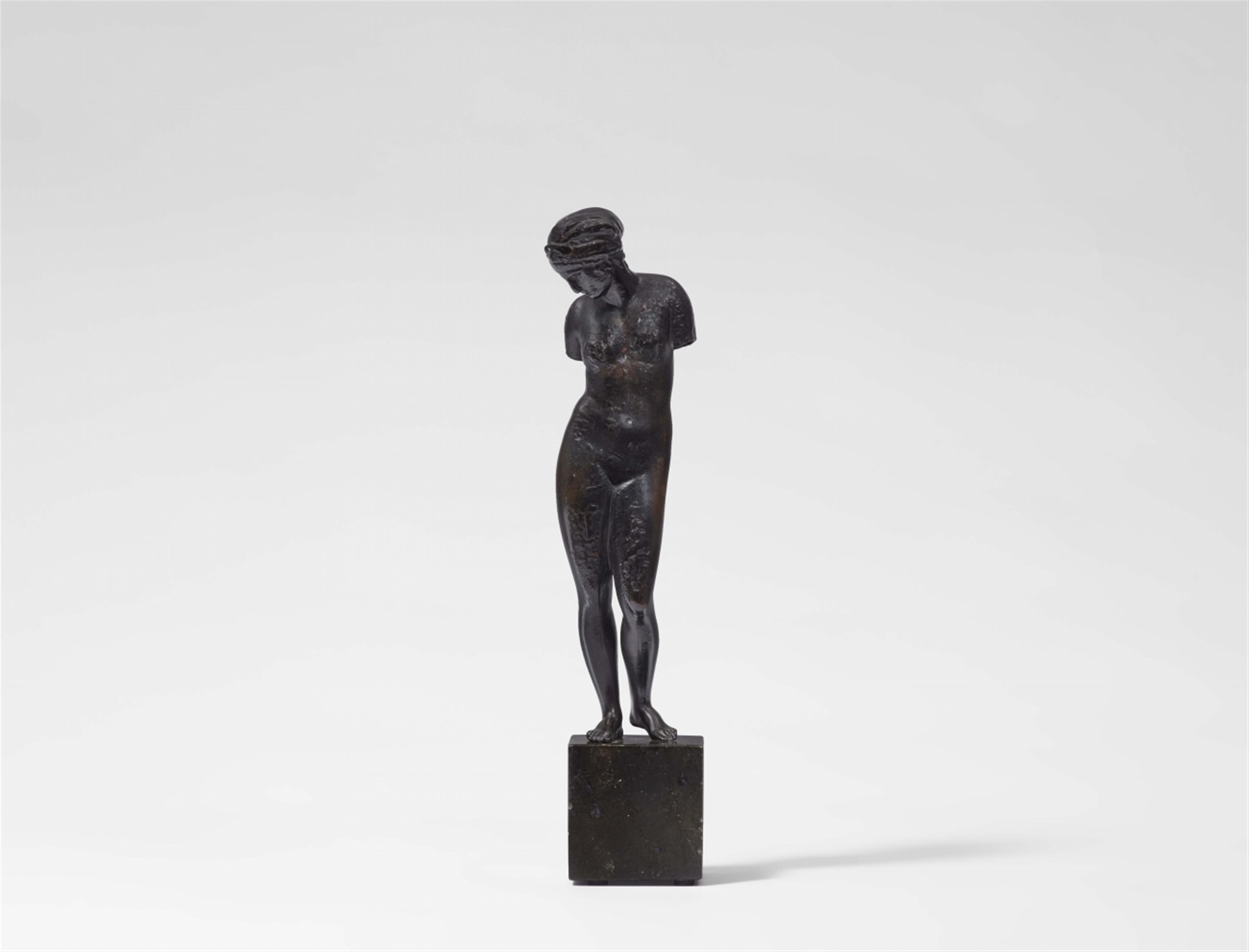 A bronze figure of a bather
Aphrodite - image-1