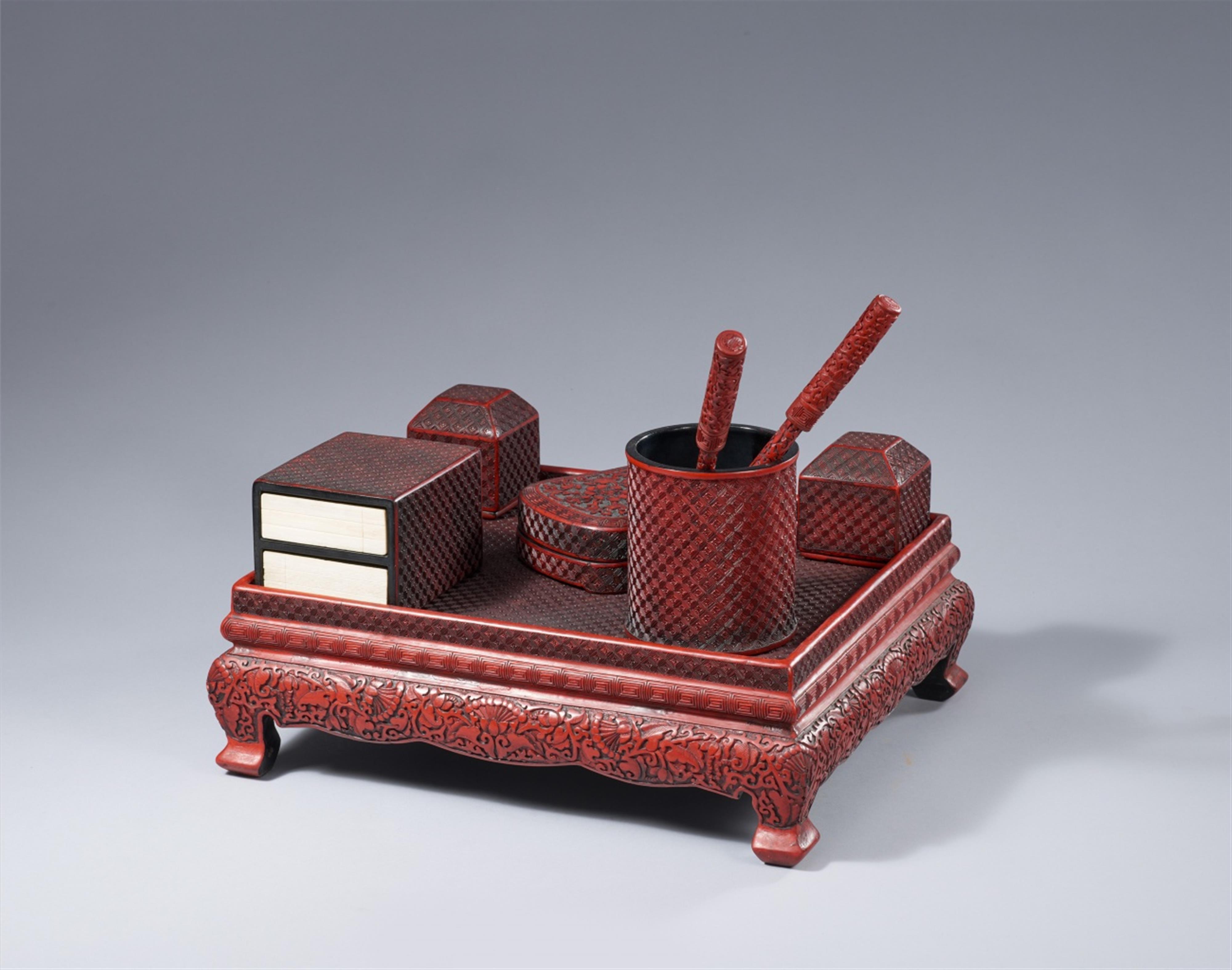 A set of writing objects on a table in the manner of carved red lacquer. 20th century - image-2