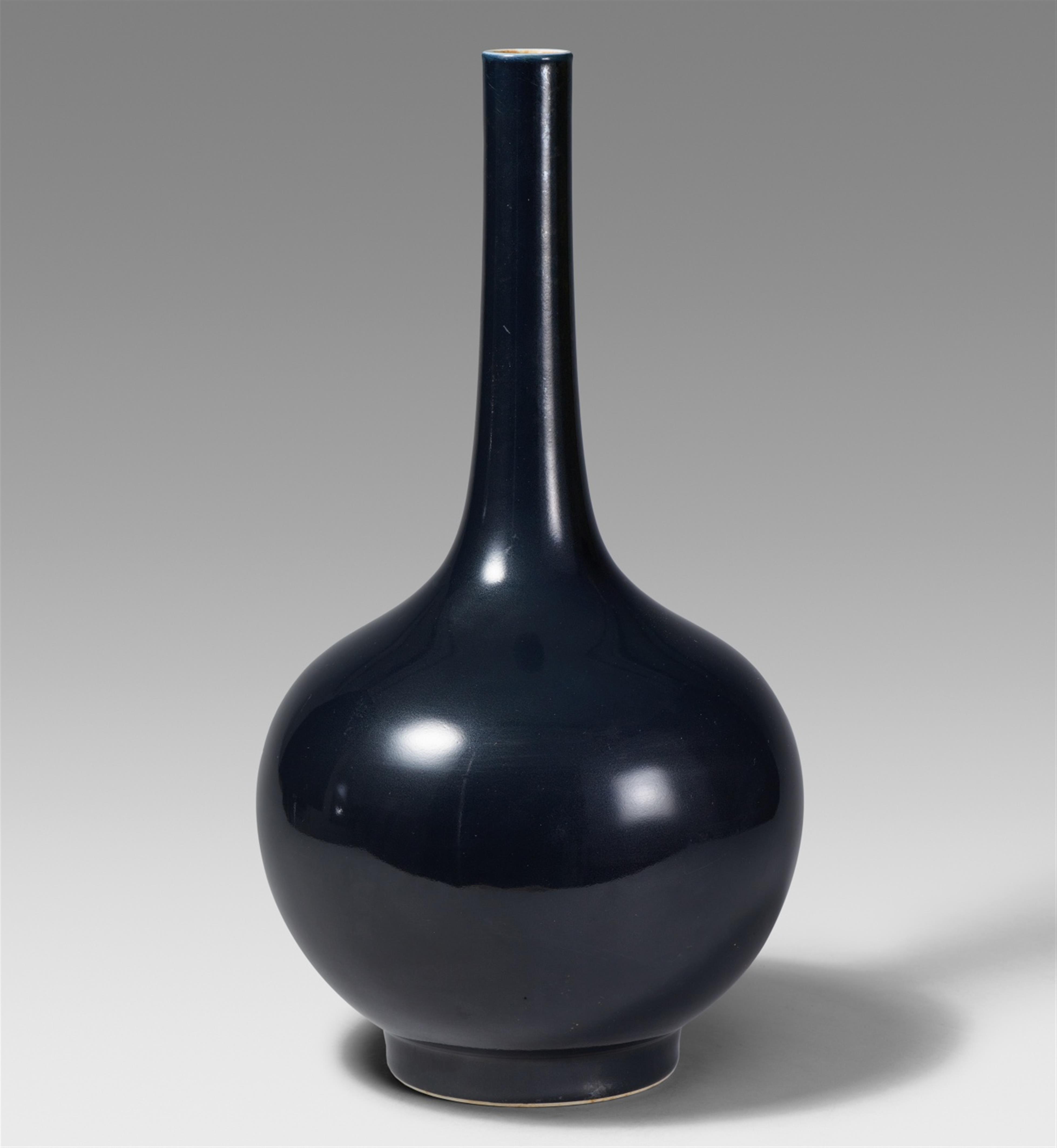 A large blueish-black-glazed bottle vase. 20th century - image-1
