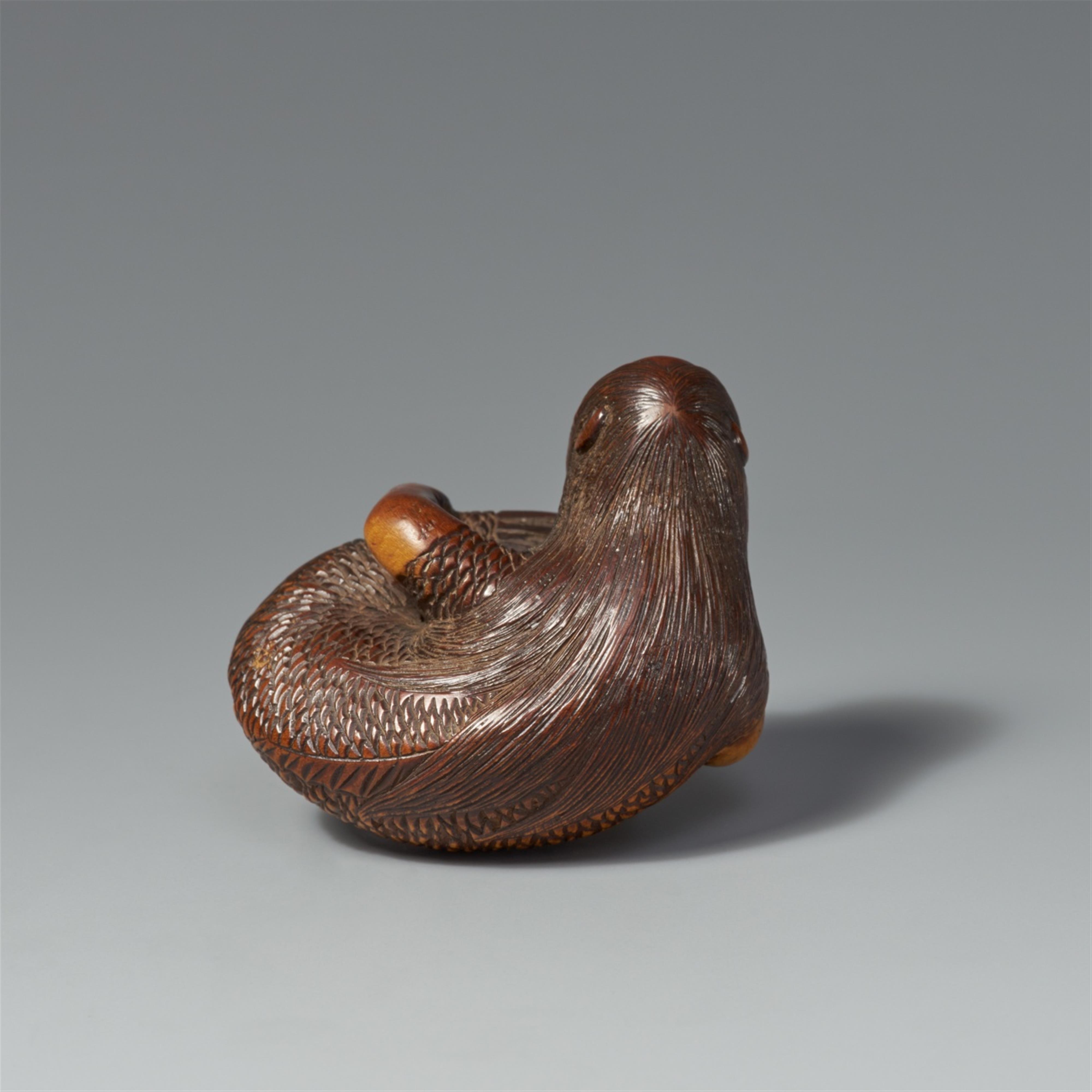 A boxwood netsuke of a reclining ningyo. 19th century - image-2