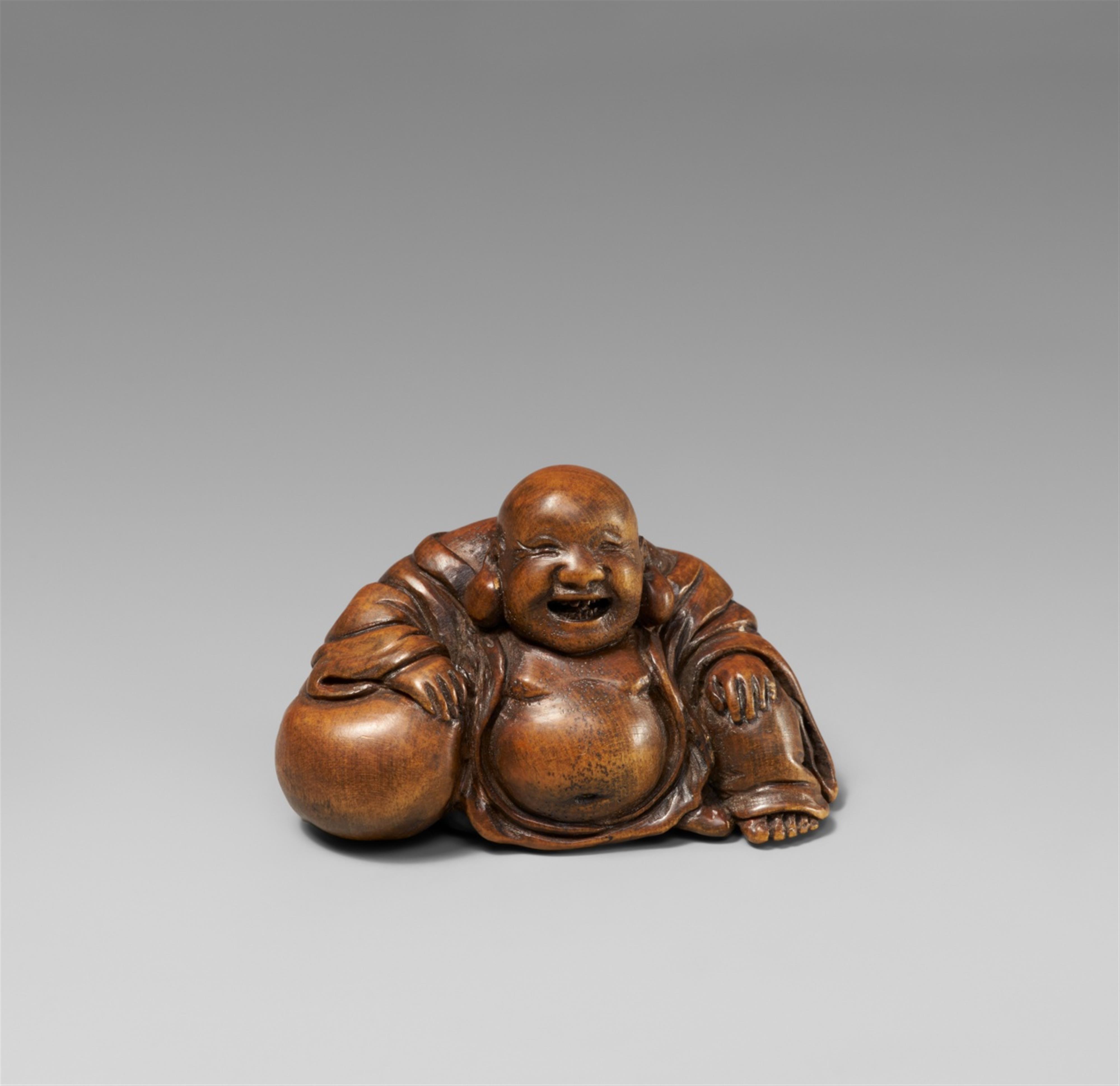 A wood netsuke of a laughing Hotei. 19th century - image-1