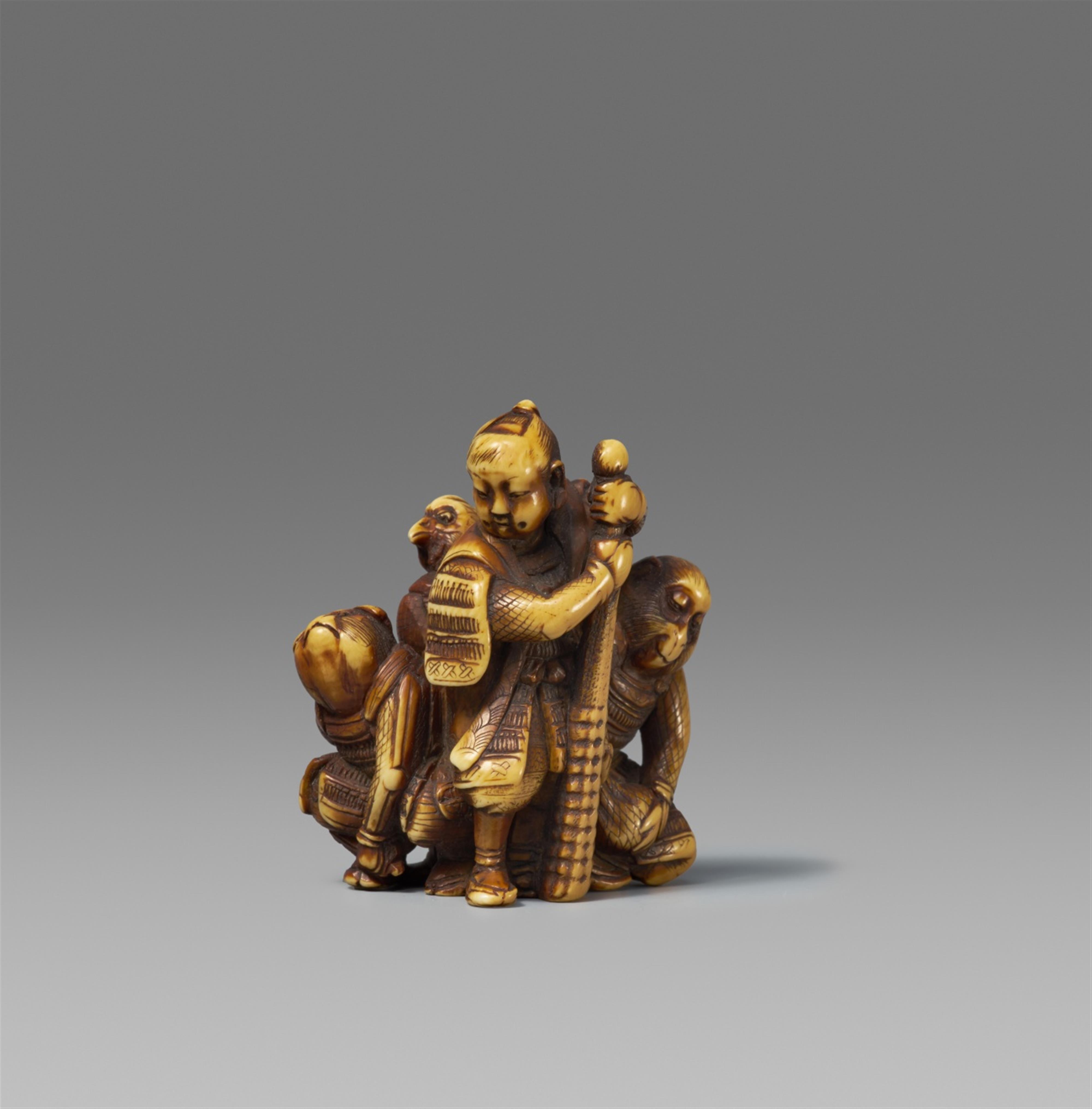 A stained ivory netsuke of Momotaro und his friends. 2nd half 19th century - image-1