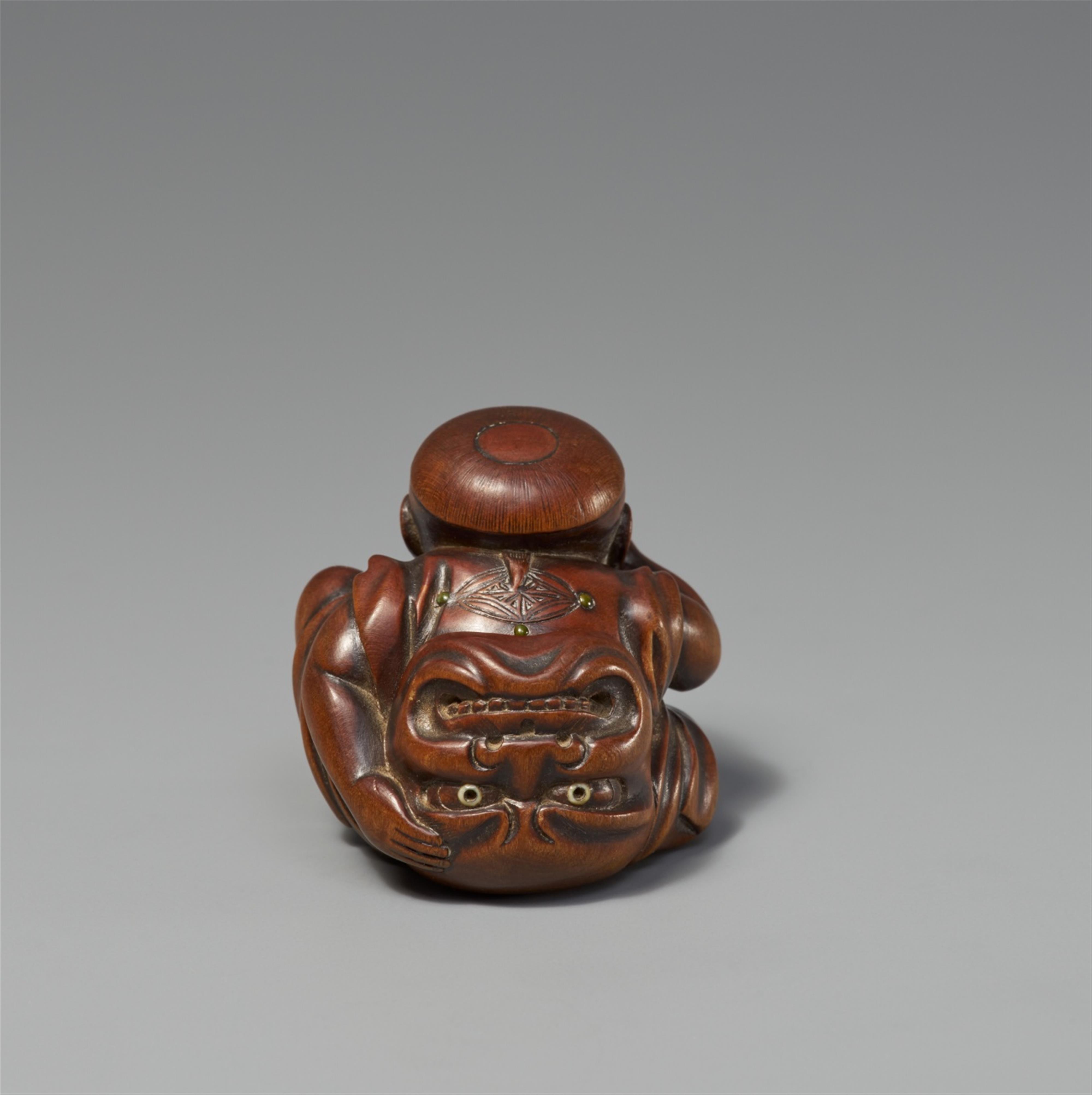 A boxwood netsuke of a boy with a Buaku mask. Mid-19th century - image-2