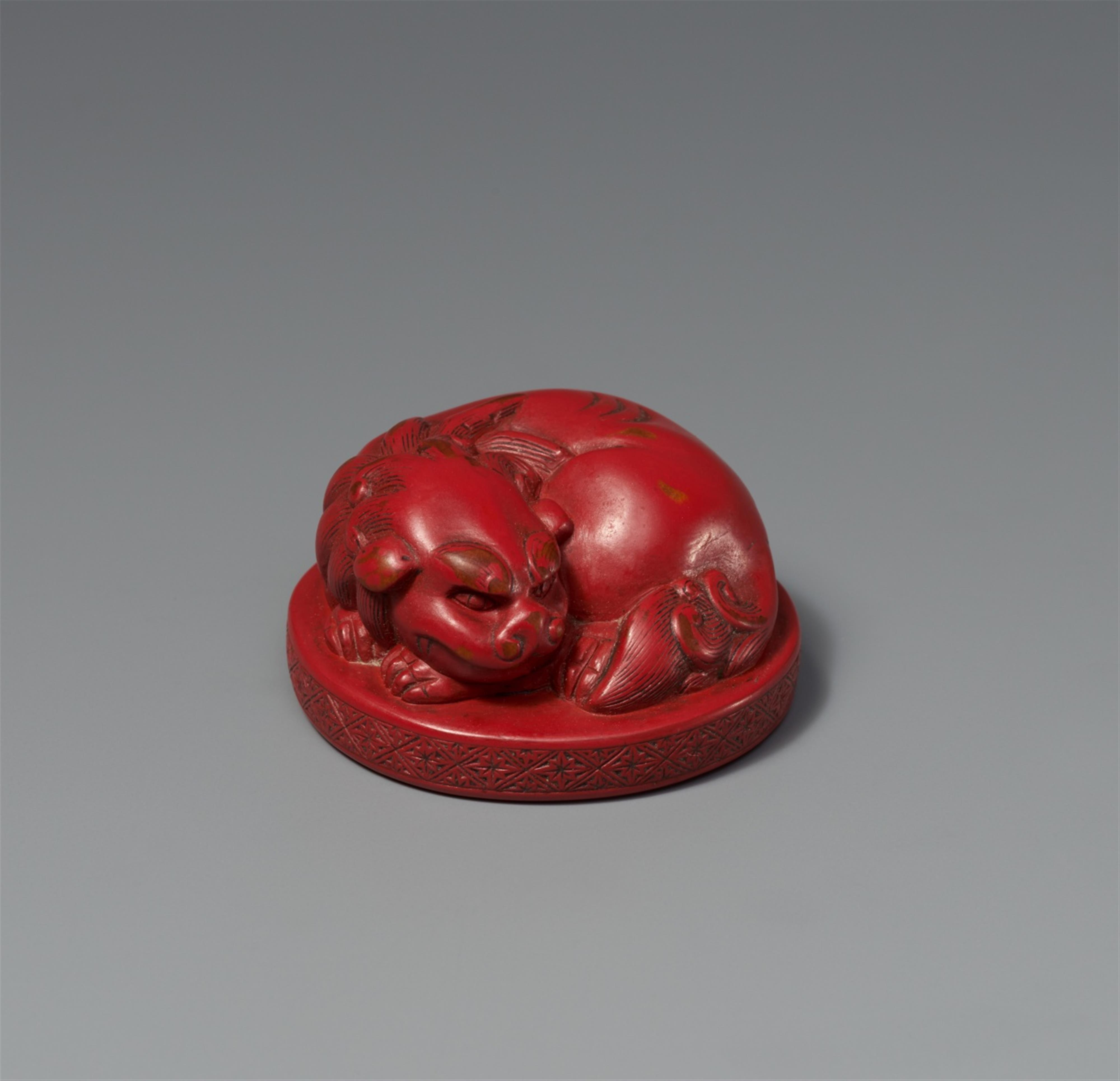 A red lacquer netsuke of a shishi. 19th century - image-1