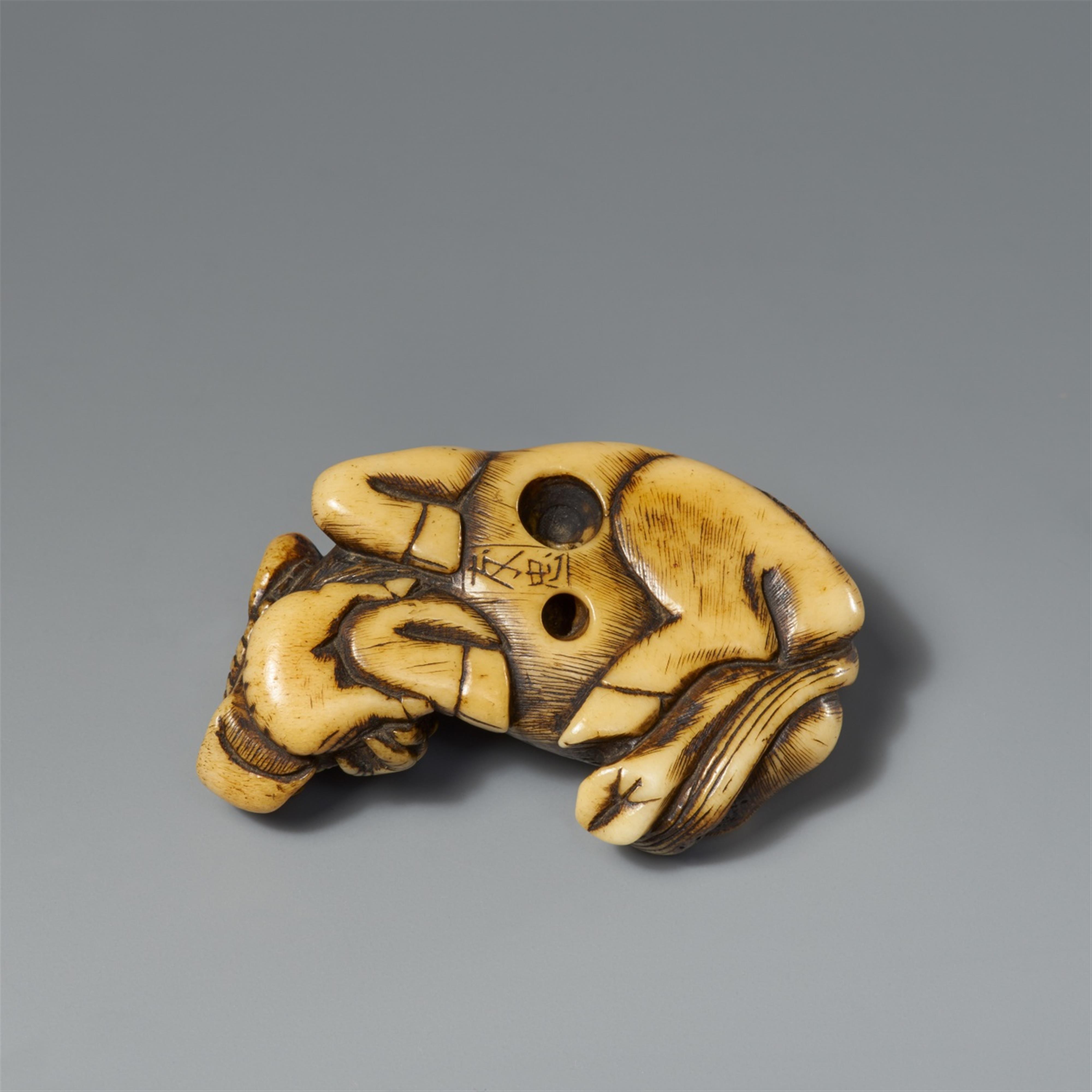 A stag antler netsuke of a recumbent ox with calf. Early 19th century  - image-2