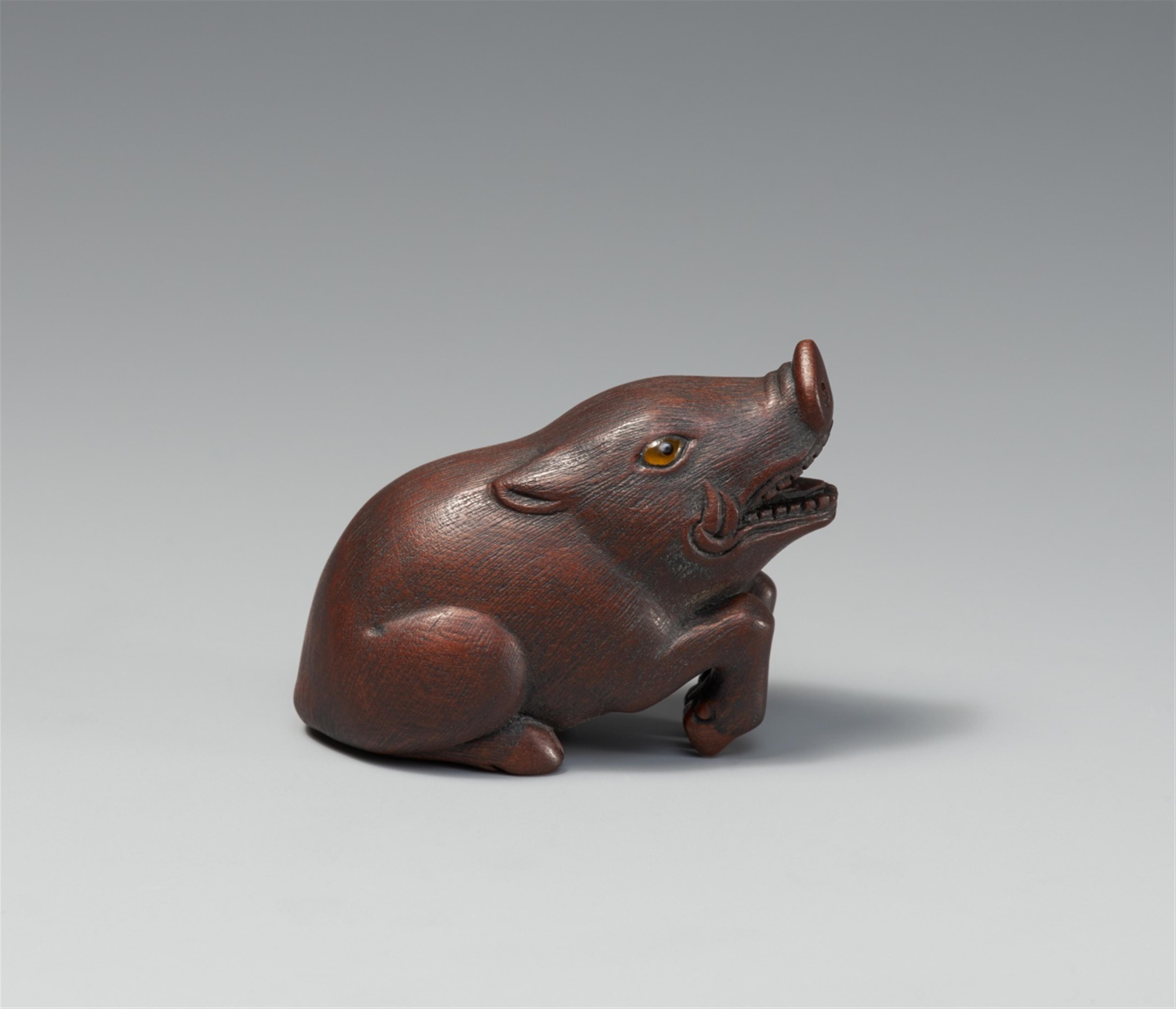 A wood netsuke of a boar. 20th century - image-2