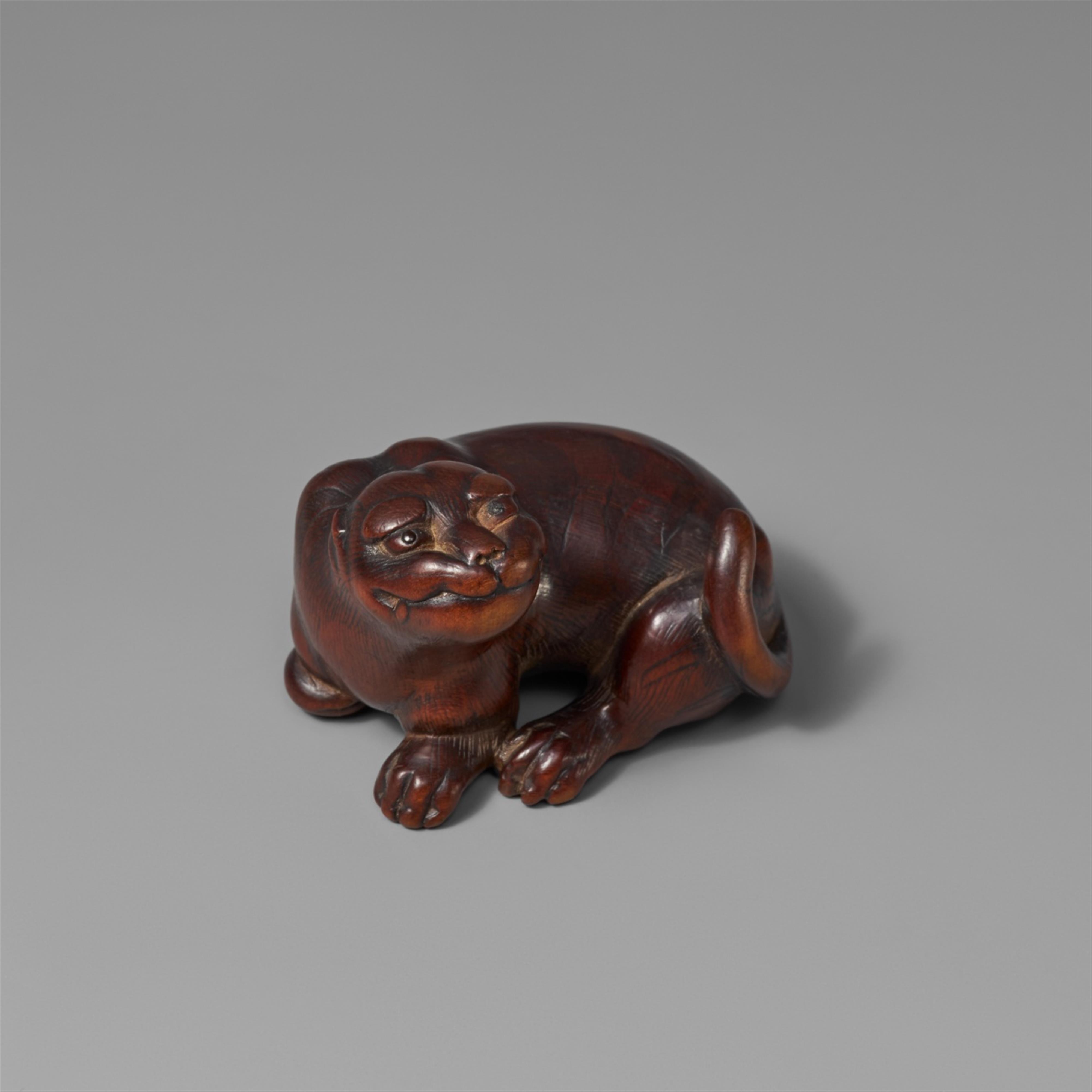 A boxwood netsuke of a grinning tiger. First half 19th century - image-1