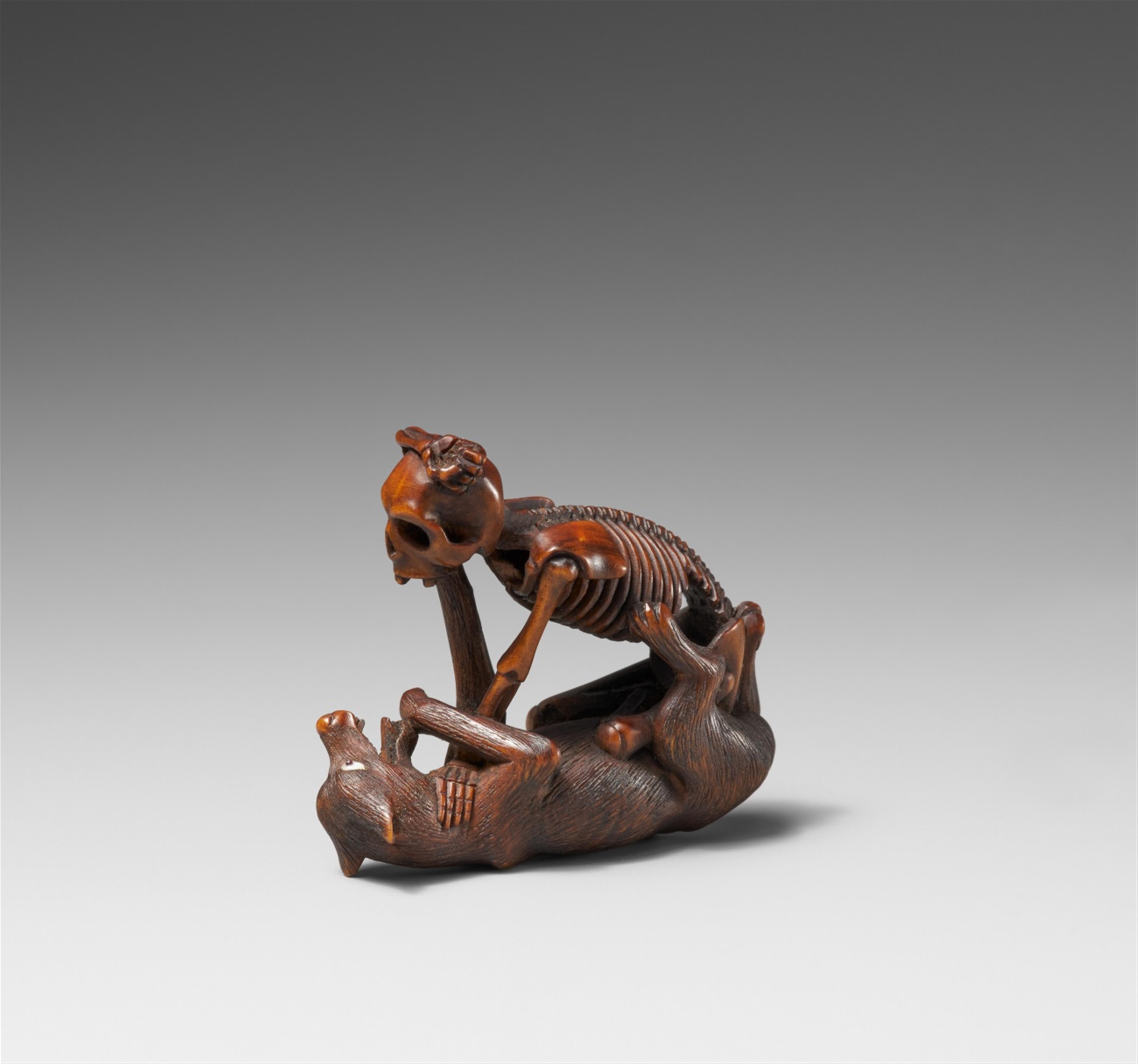 A Hida school boxwood netsuke of a skeleton and a wolf, in the manner of Shoko. Late 19th century - image-2