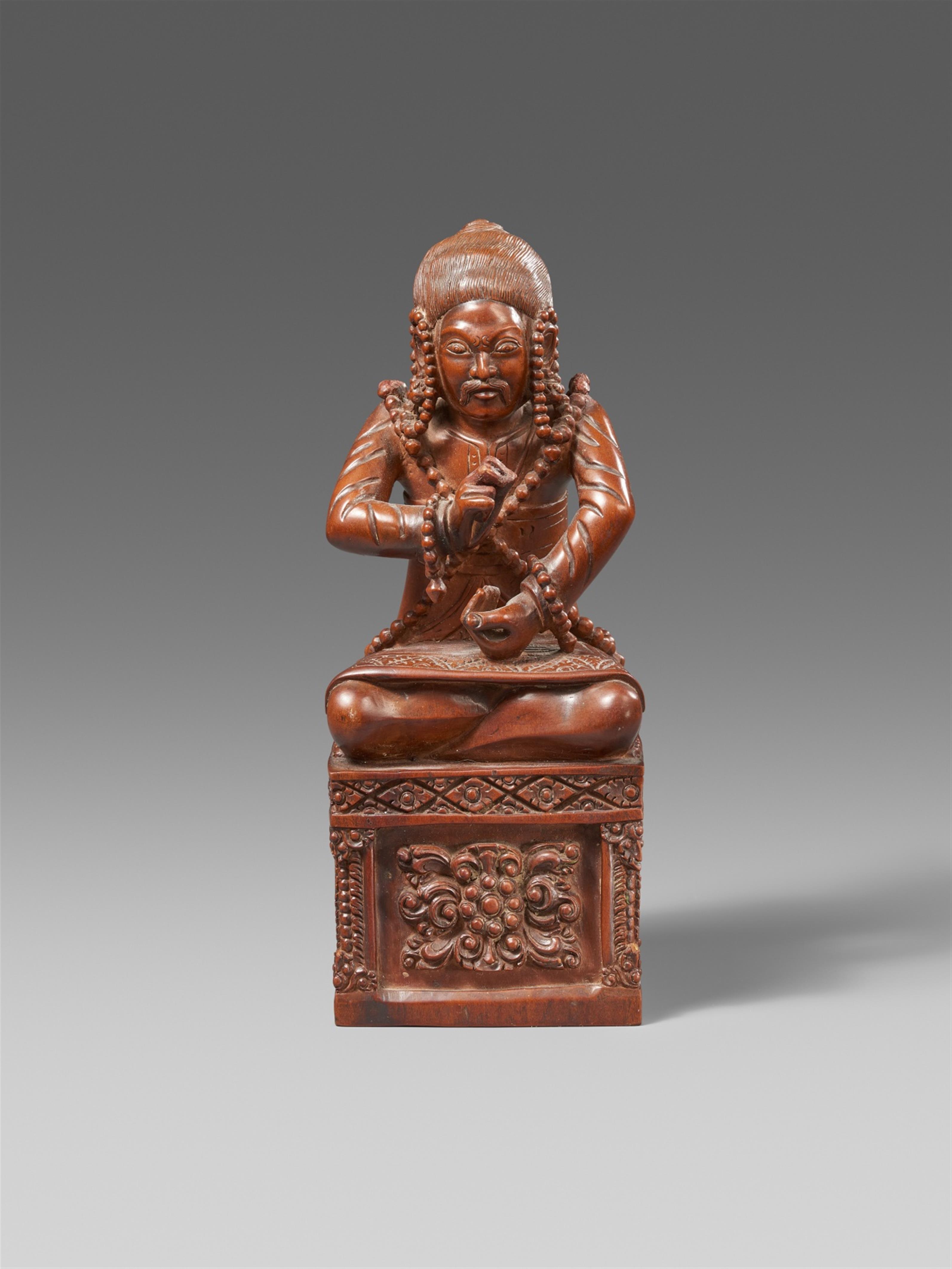 A rare Tibetan wooden figure of a dignitary in the style of the Tenth Karmapa Choying Dorje. 18th/19th century - image-1