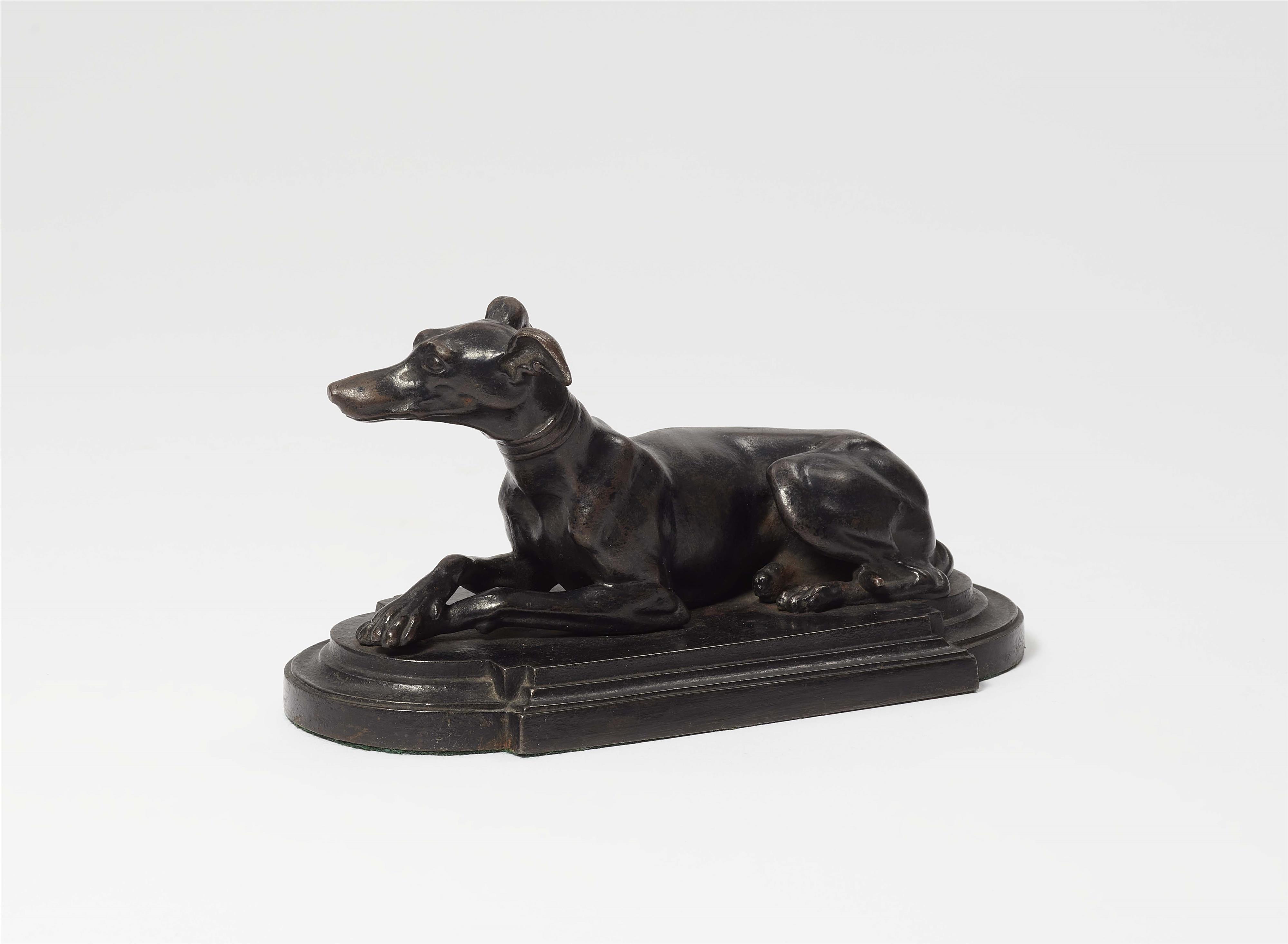 A cast iron paperweight with a greyhound - image-1