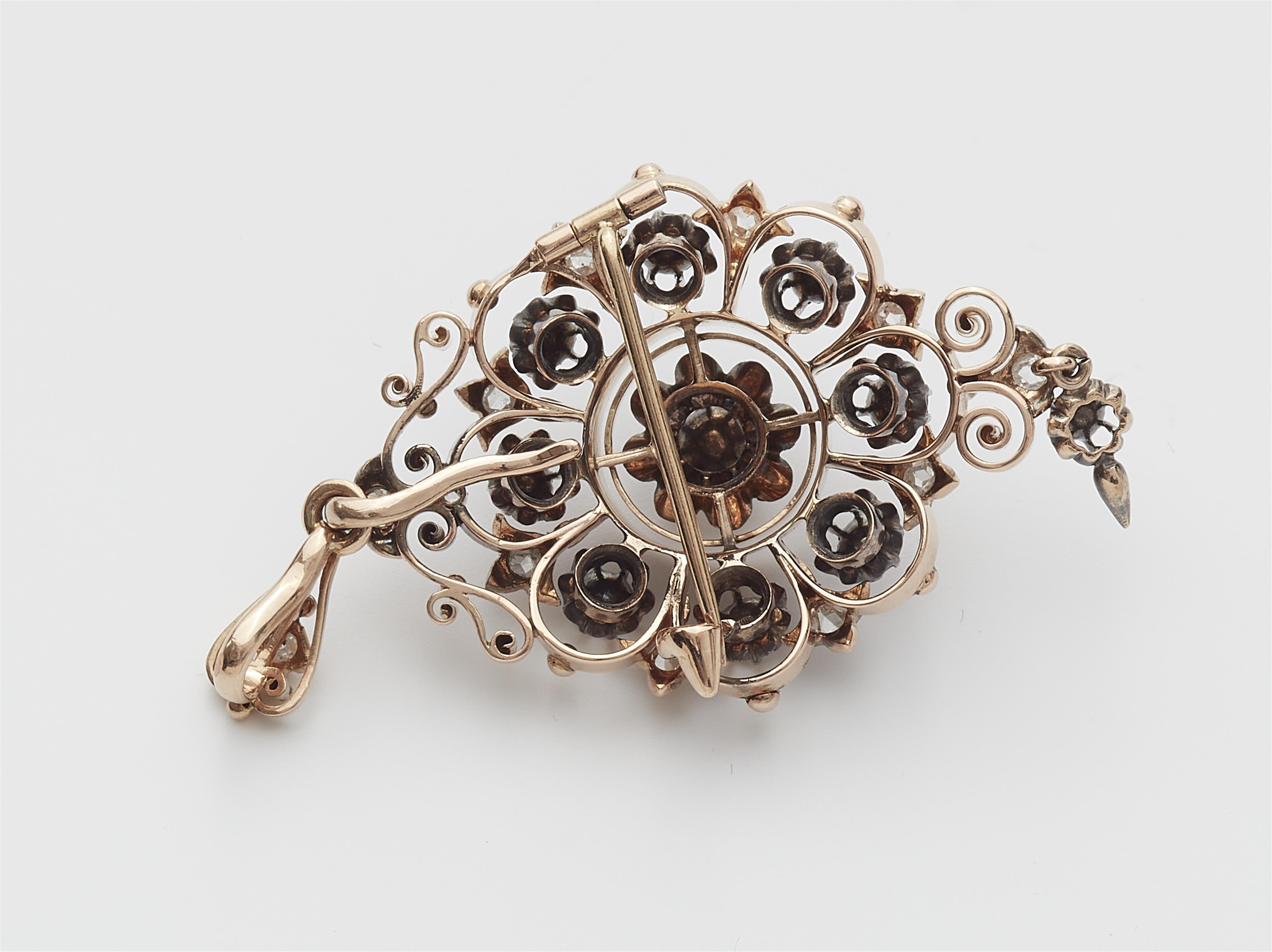 A late 19th century 14k red gold and diamond pendant brooch. - image-2