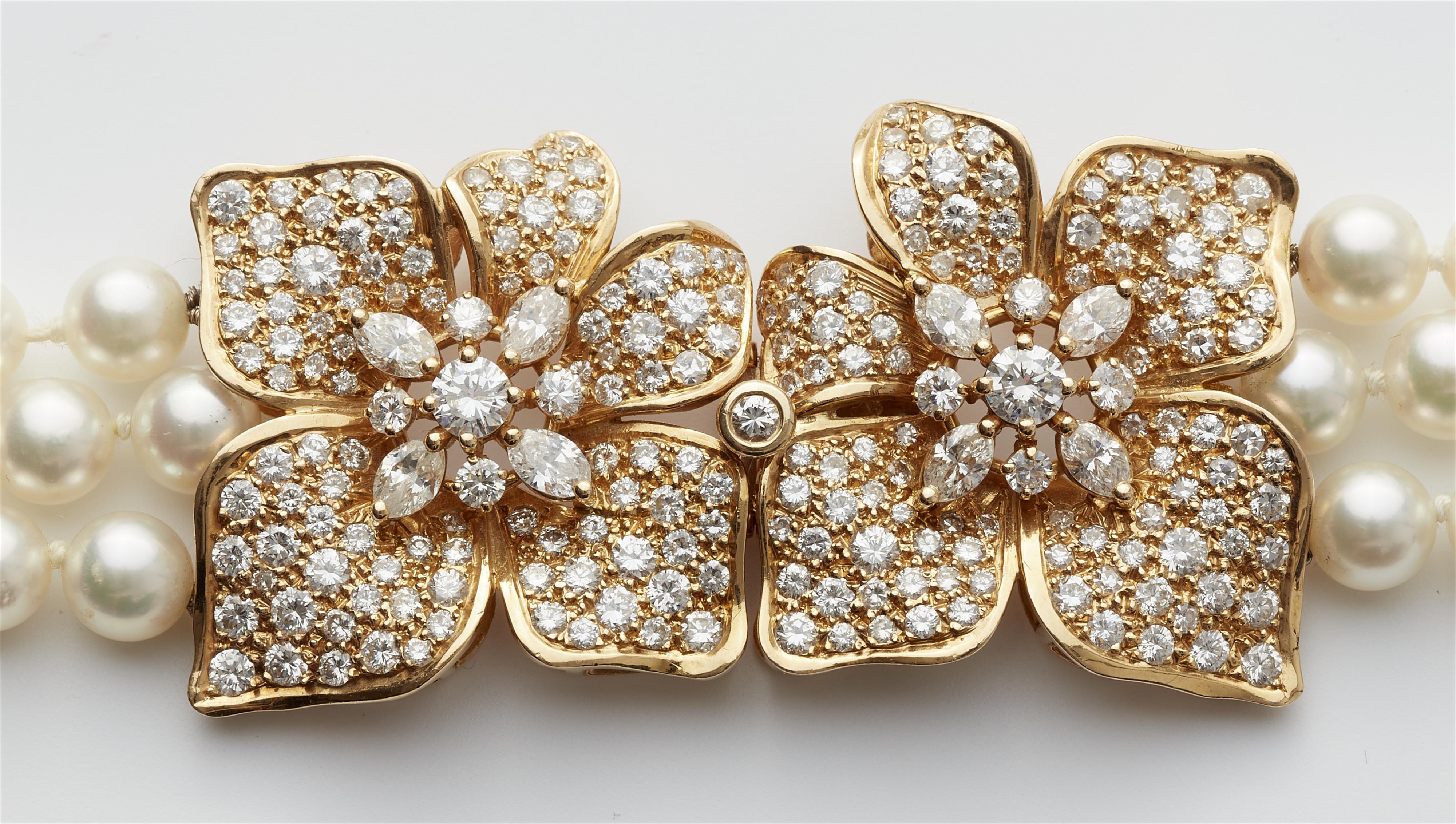 A French cultured pearl necklace with an 18k gold and diamond flower clasp. - image-2