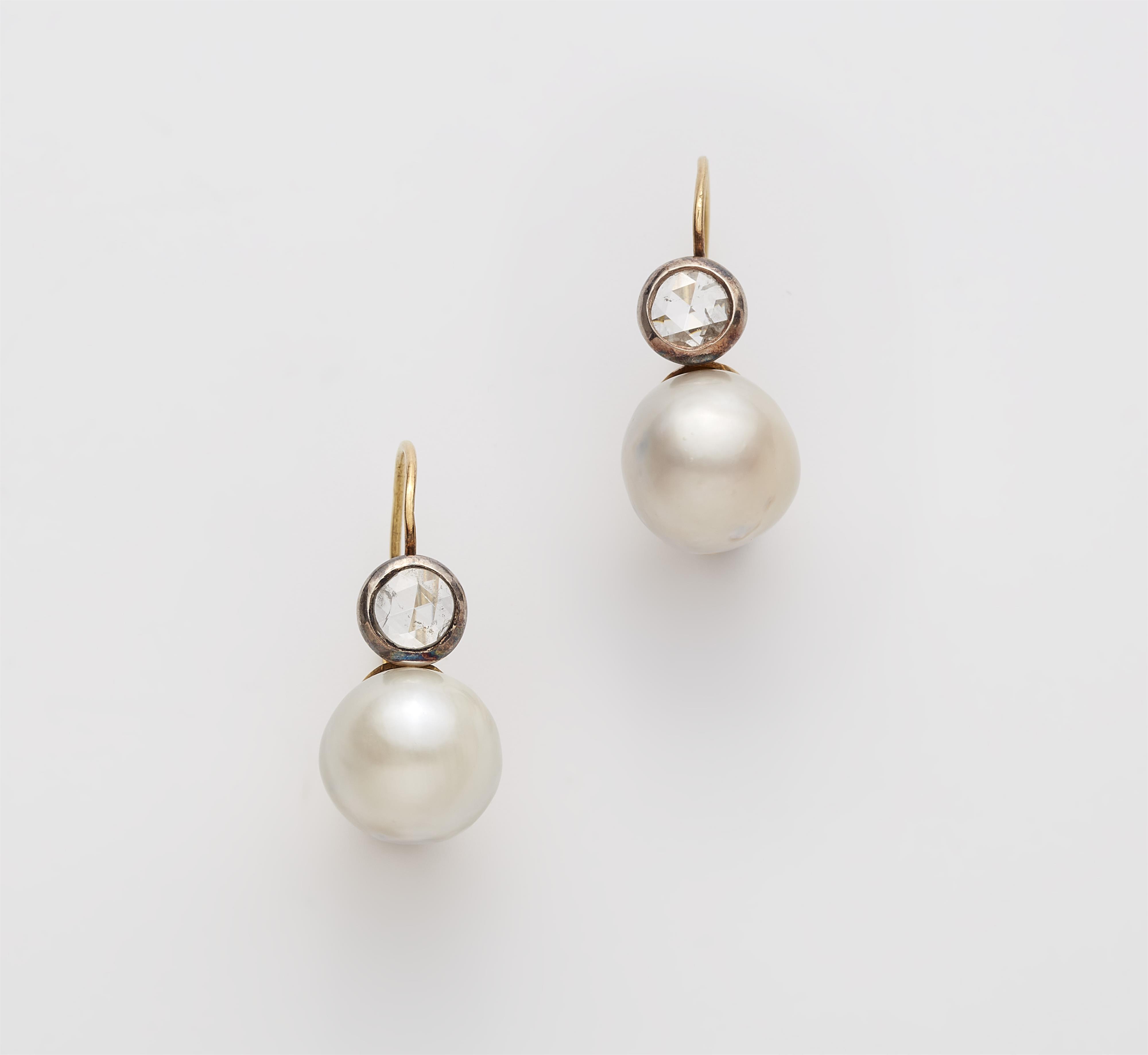 A pair of 18k gold diamond and South Sea cultured pearl earrings. - image-1