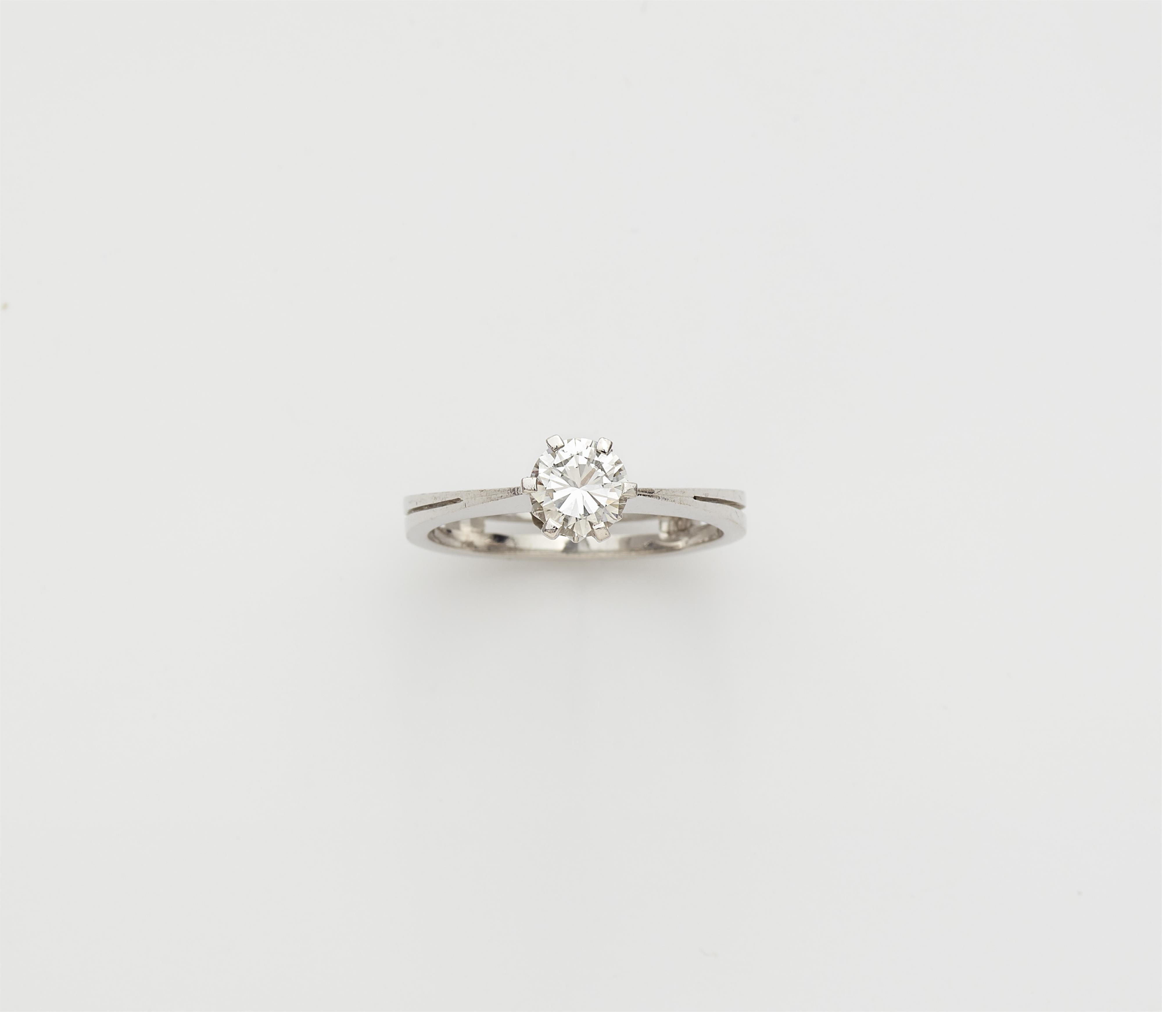 An 18k white gold and diamond solitaire ring. - image-1