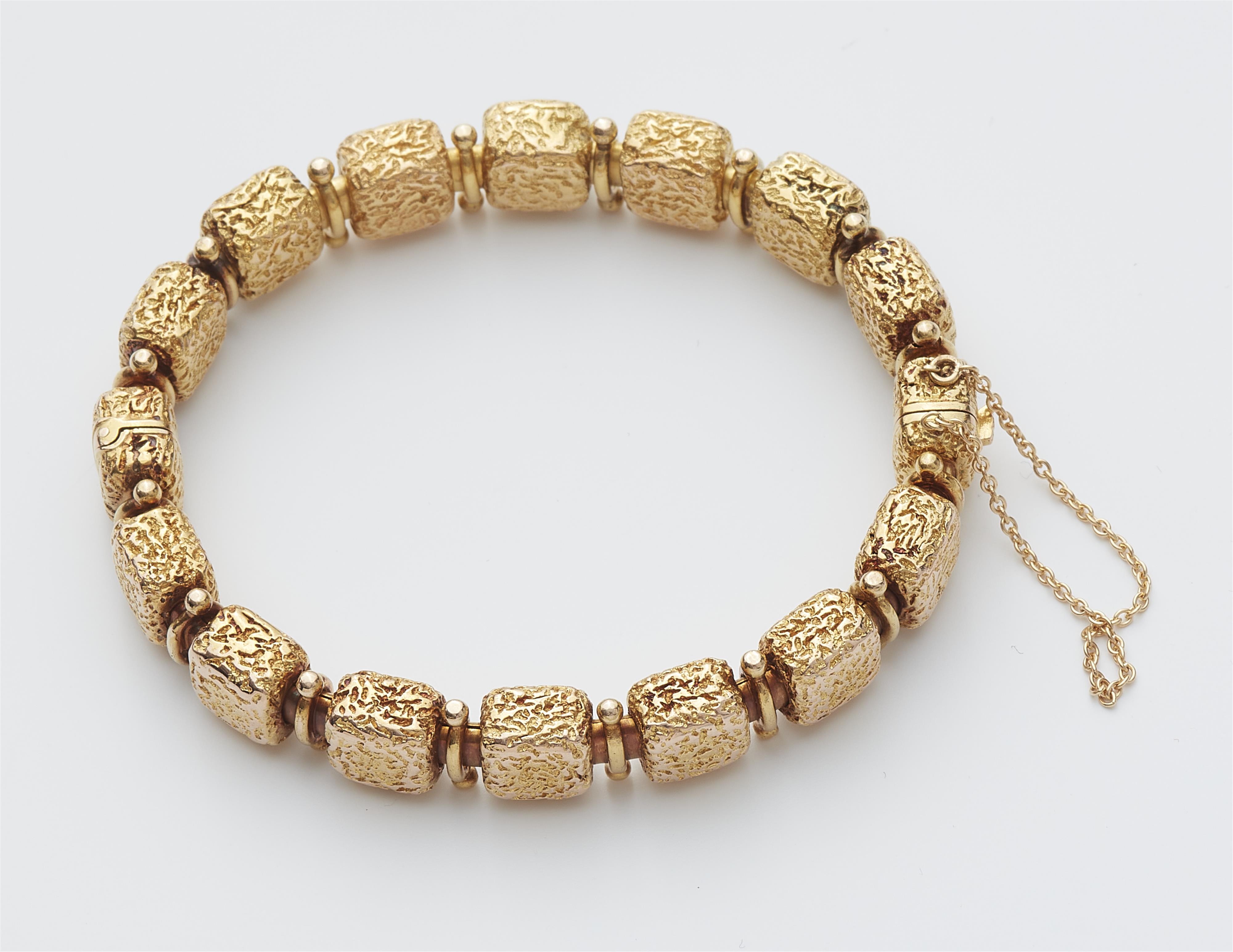 A 14k gold sapphire and diamond bangle. - image-2