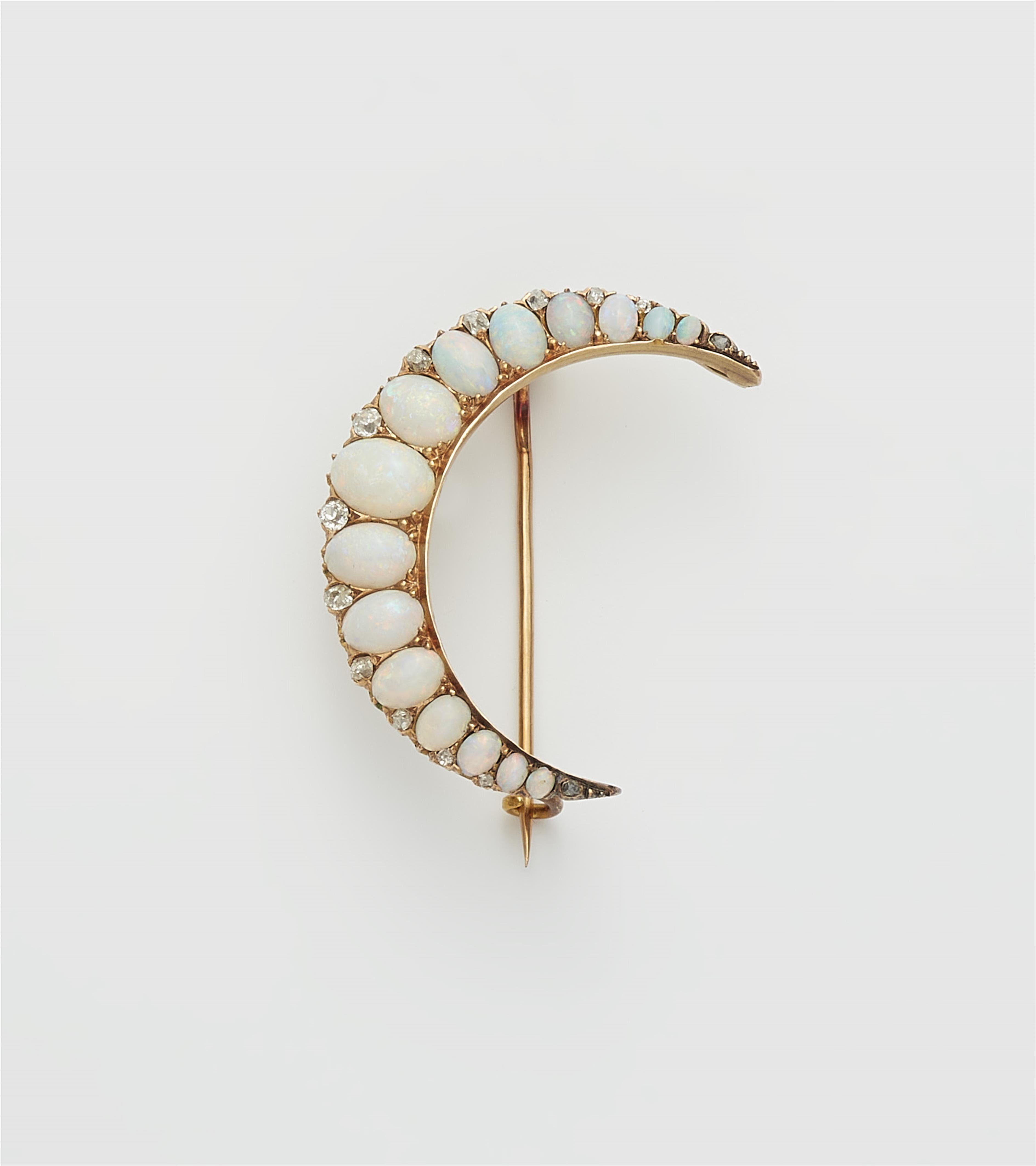 A 14k gold opal and diamond crescent moon brooch. - image-1