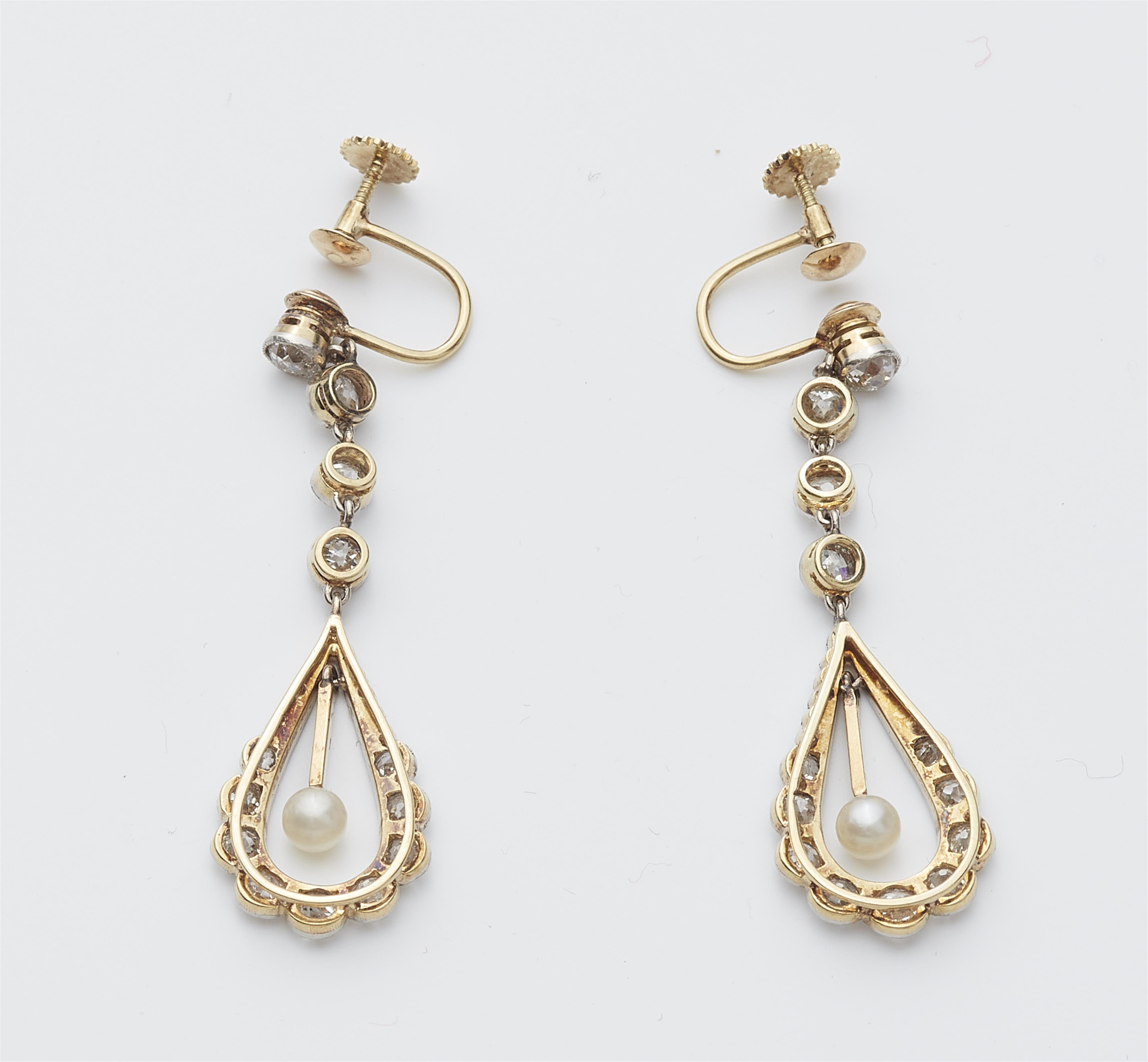 A pair of Belle Epoque 14k gold diamond and pearl pendant earrings. - image-2