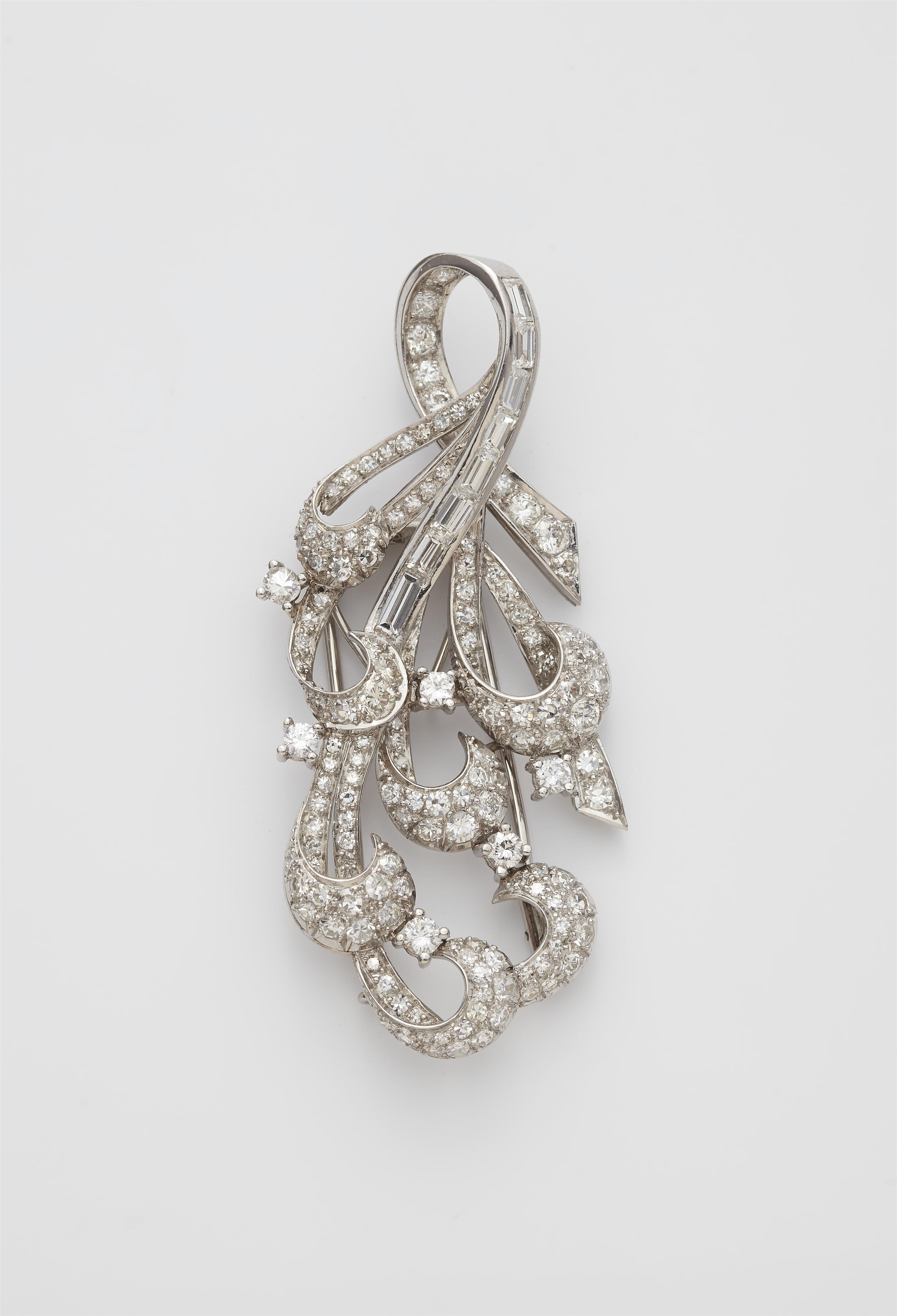 An 18k white gold and diamond Retro style clip brooch. - image-1
