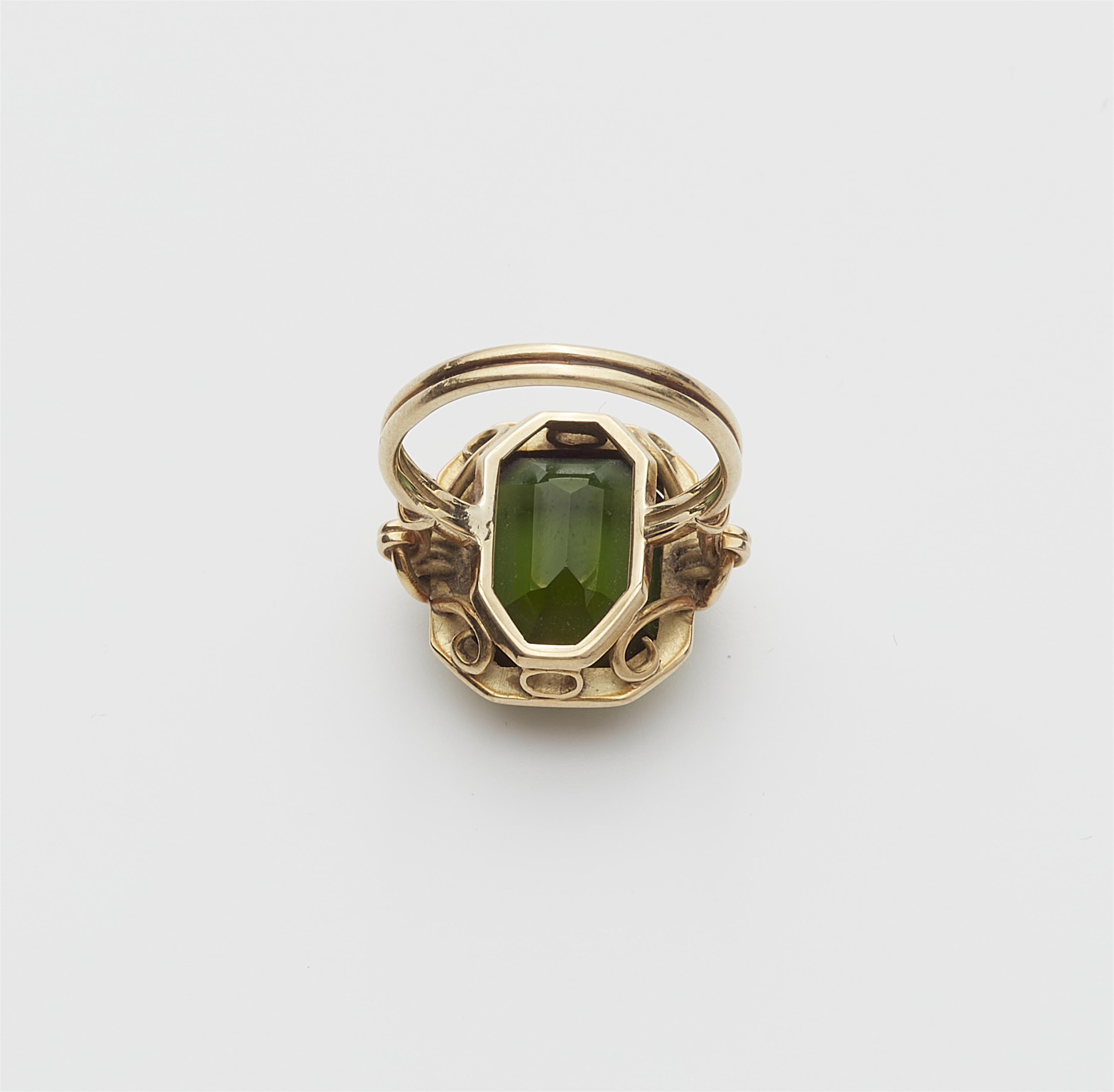 A 14k gold and green tourmaline ring. - image-2