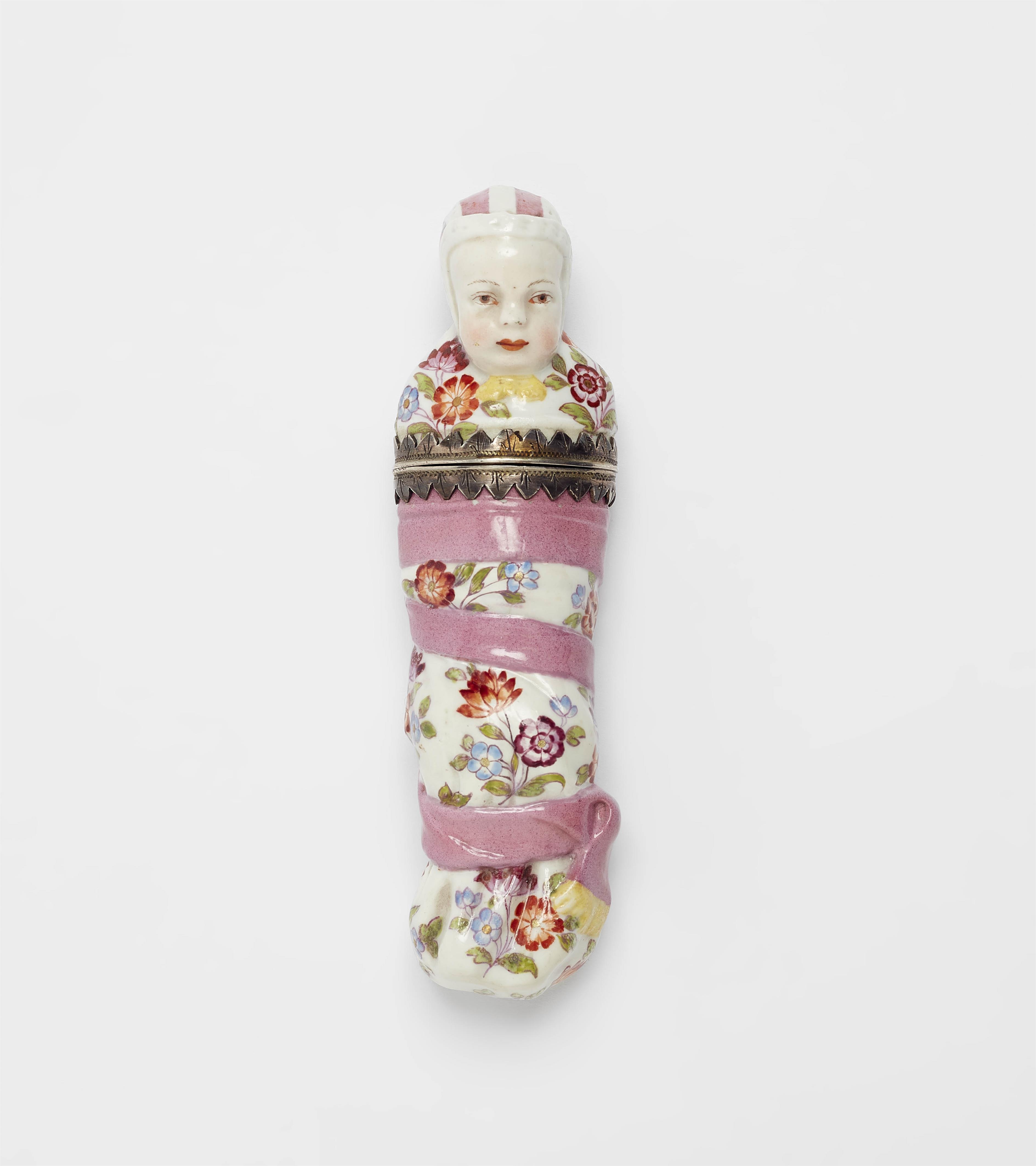 A porcelain model of a baby as a needle case - image-1