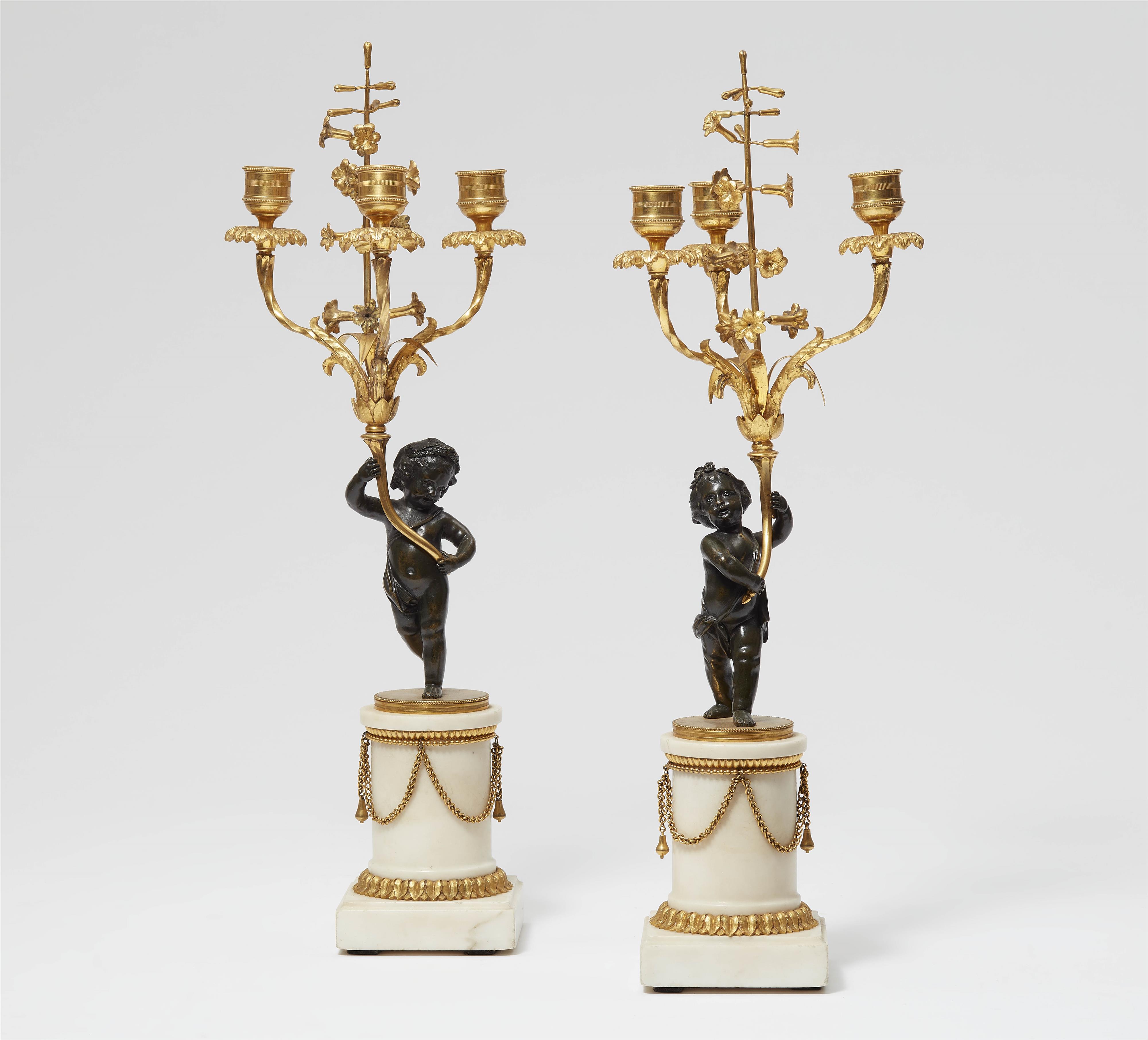 A pair of candelbra with bronze figures - image-1