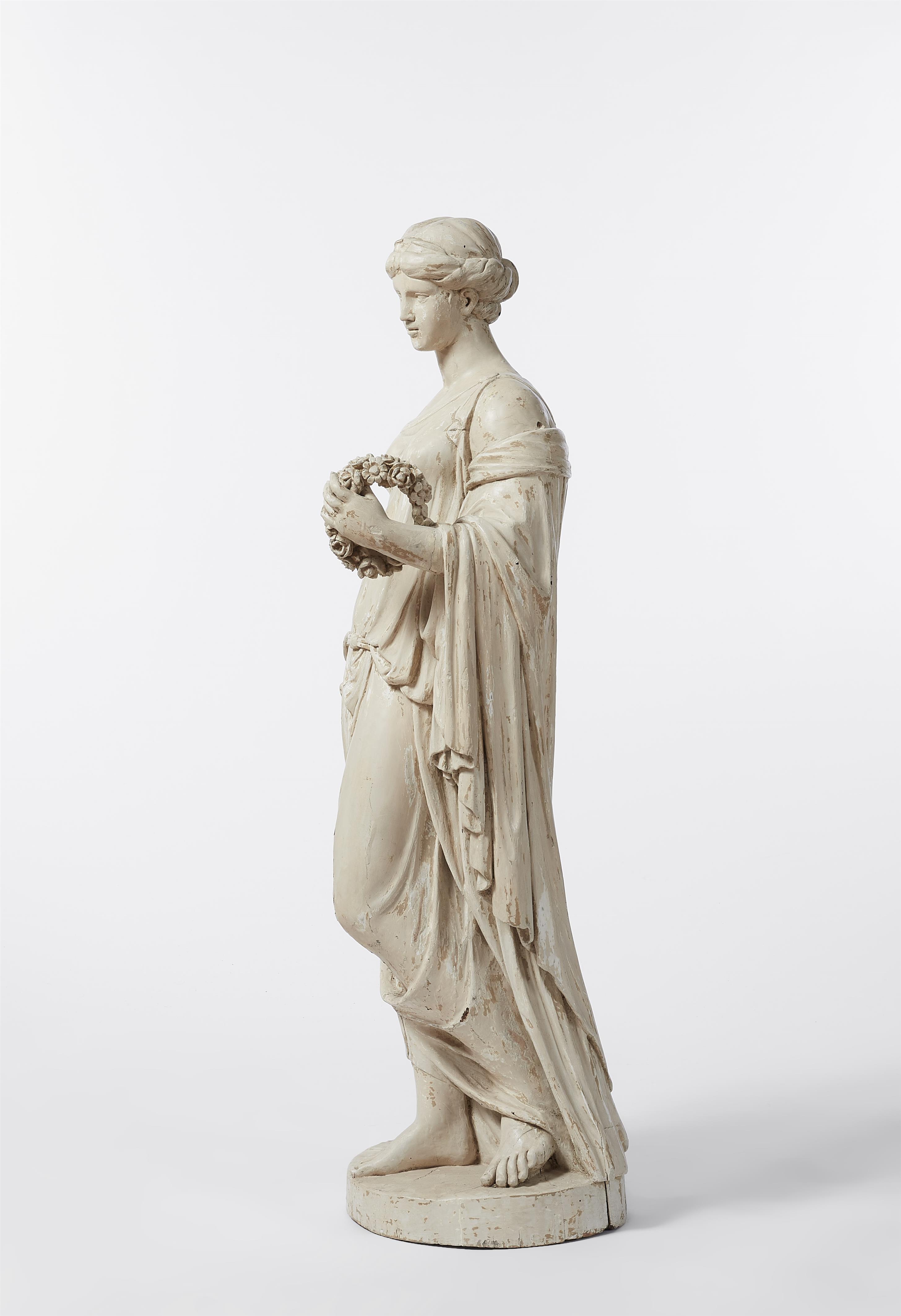 A carved softwood figure of a lady with a wreath / Flora - image-2