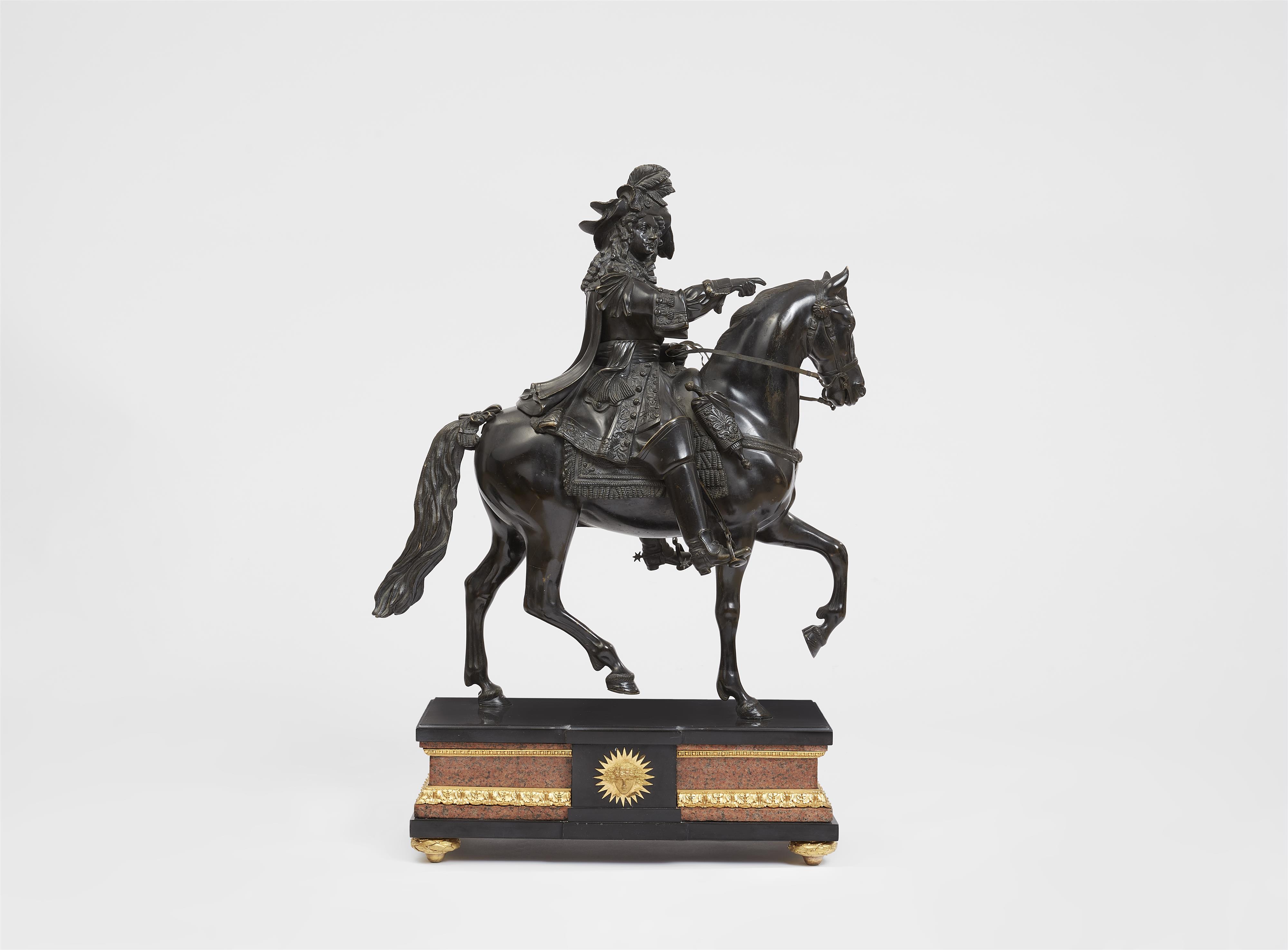 A bronze figure of Louis XIV riding into battle - image-1