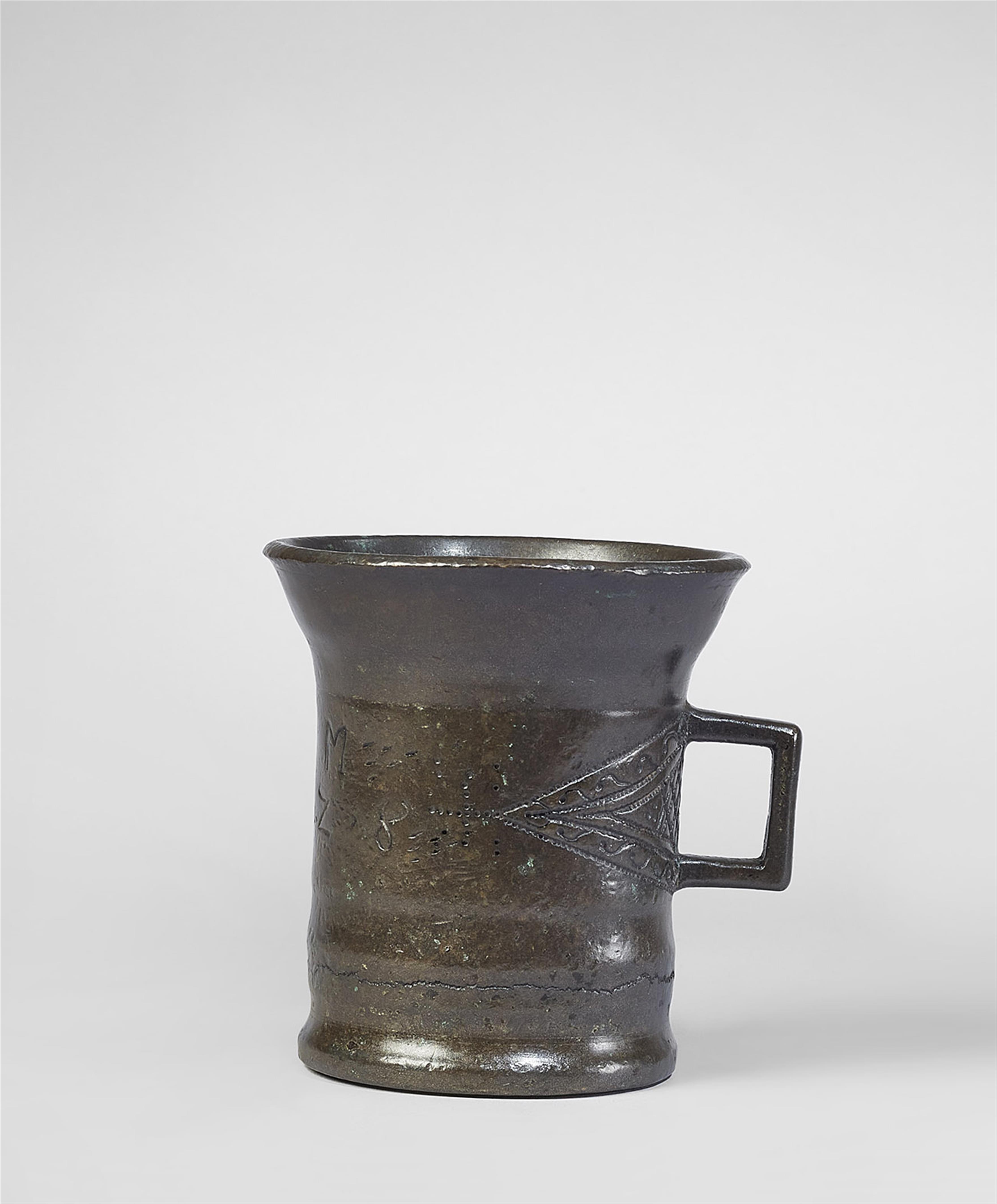 A small single-handled mortar dated 1728 - image-1